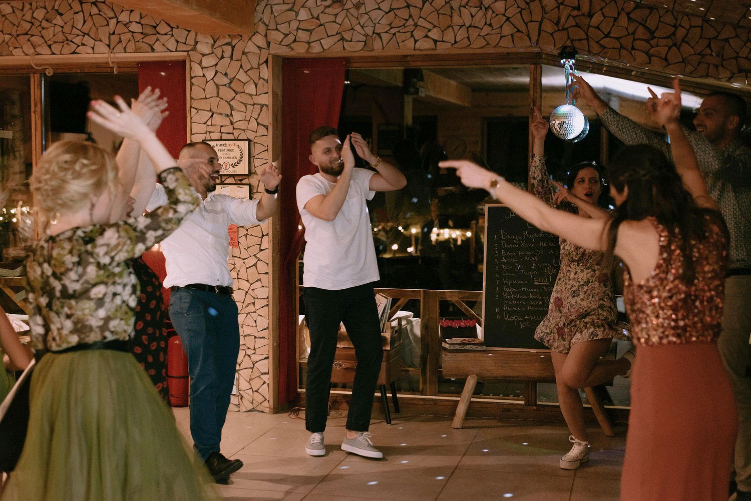 Guests enjoying themselves on the dance floor at a wedding reception.