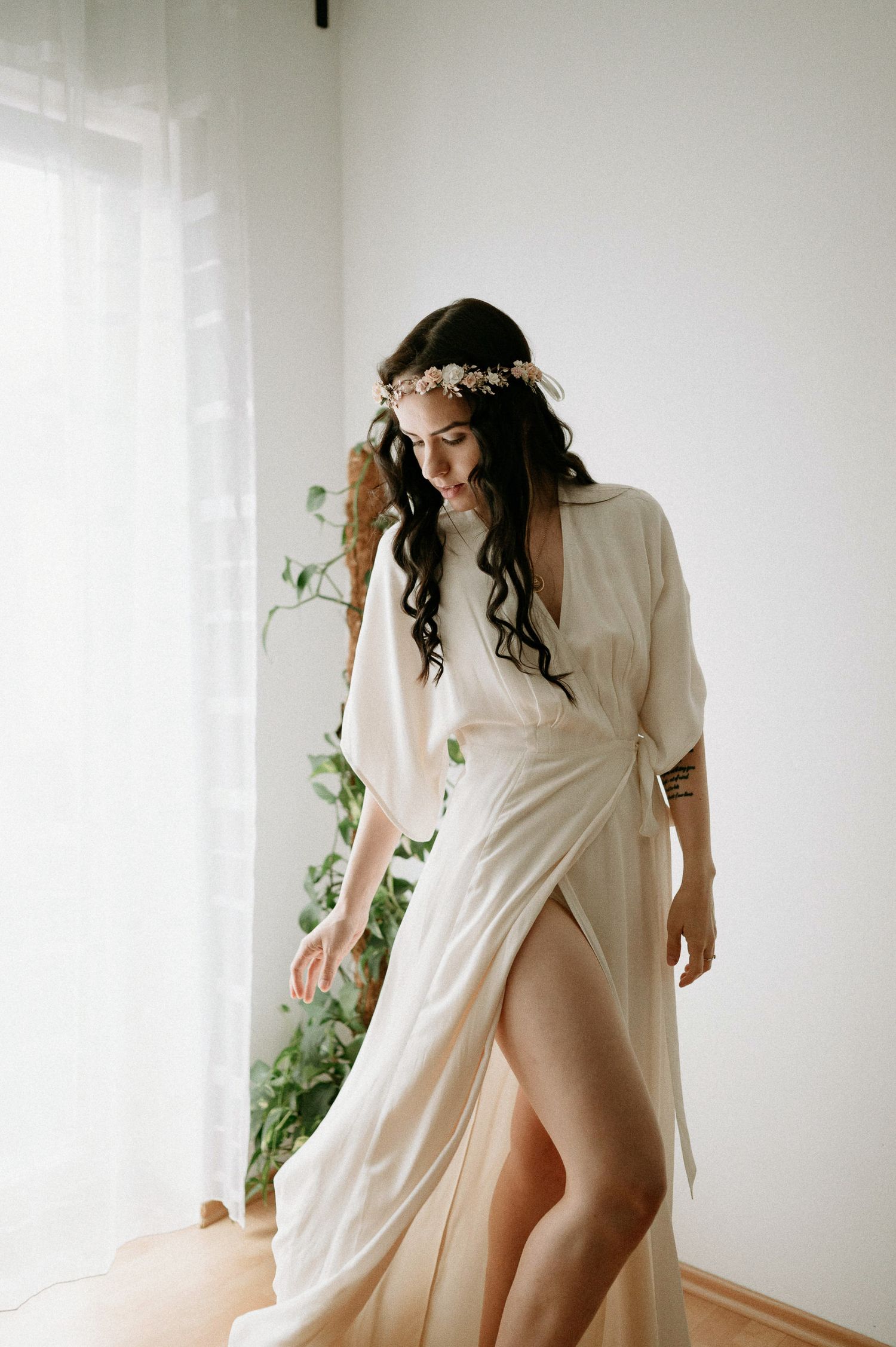 Romantic boudoir session featuring flowing fabric and delicate movement in natural light.