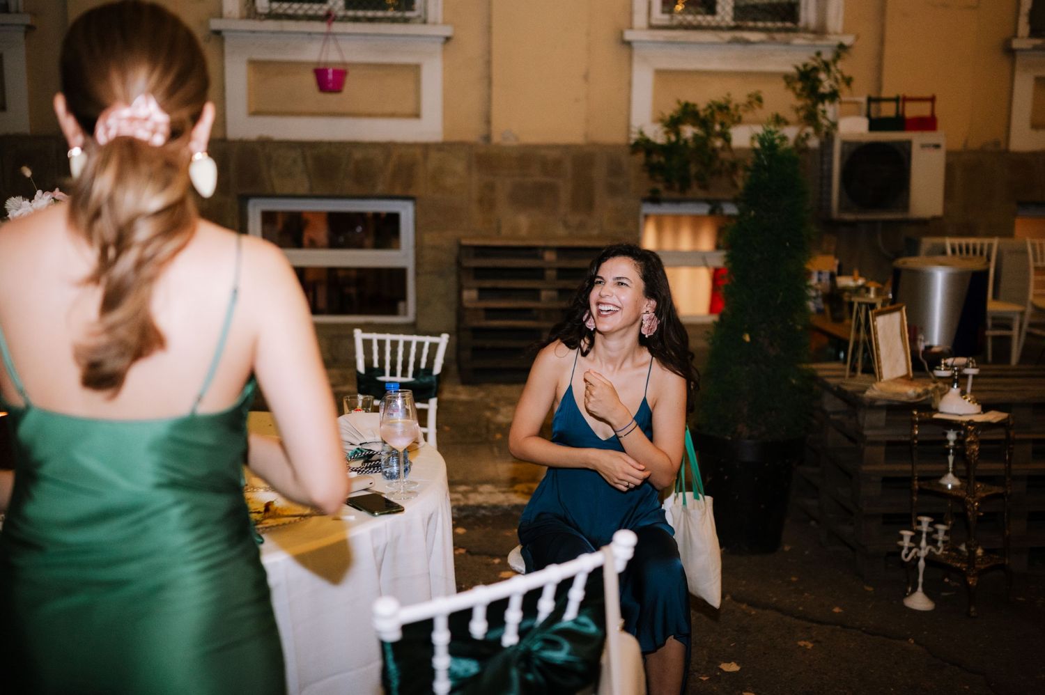 A series of candid wedding reception photos showing guests dancing and celebrating in an indoor venue.