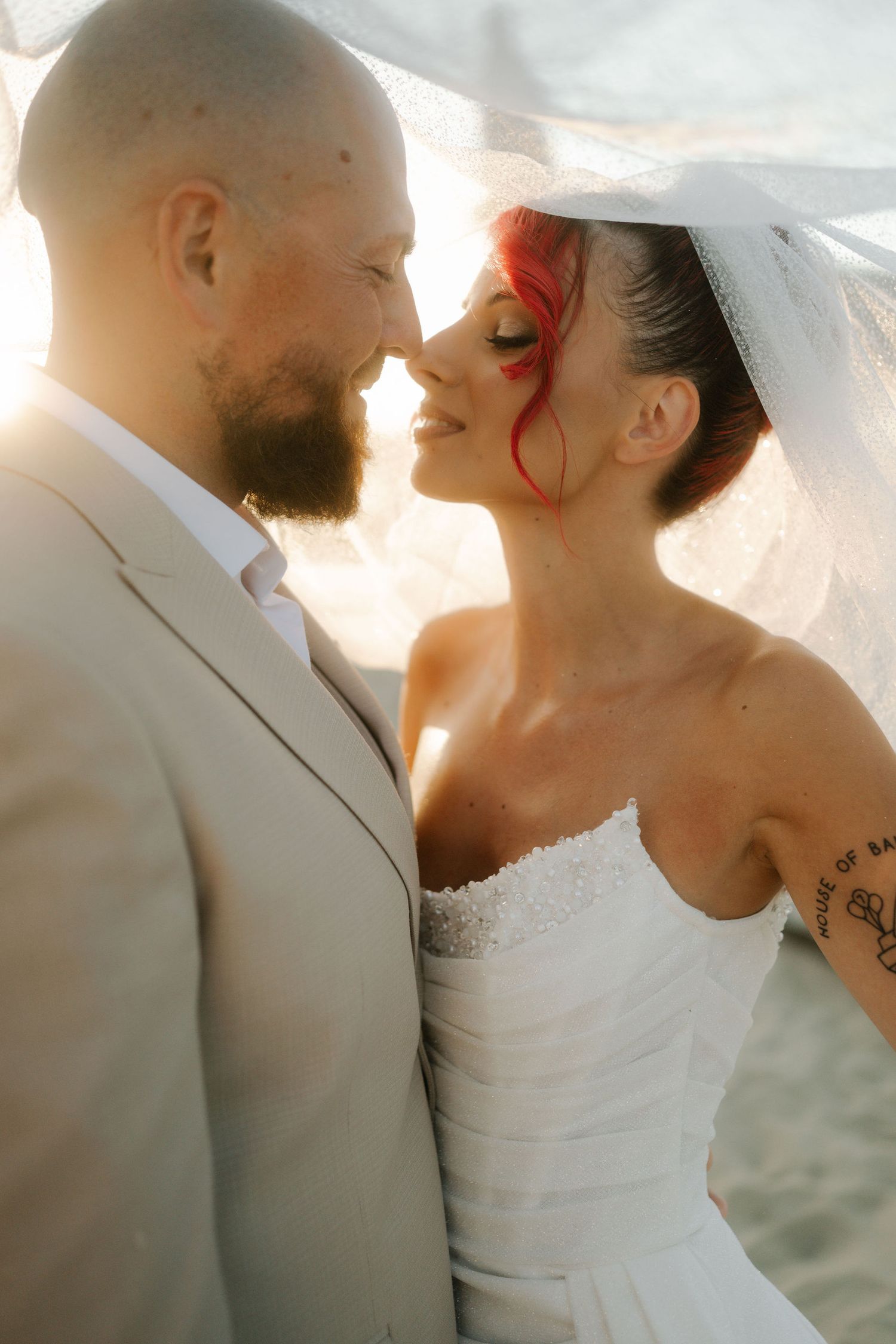 Artistic sequence of romantic wedding couple silhouetted against bright sunlight in soft dreamy style.