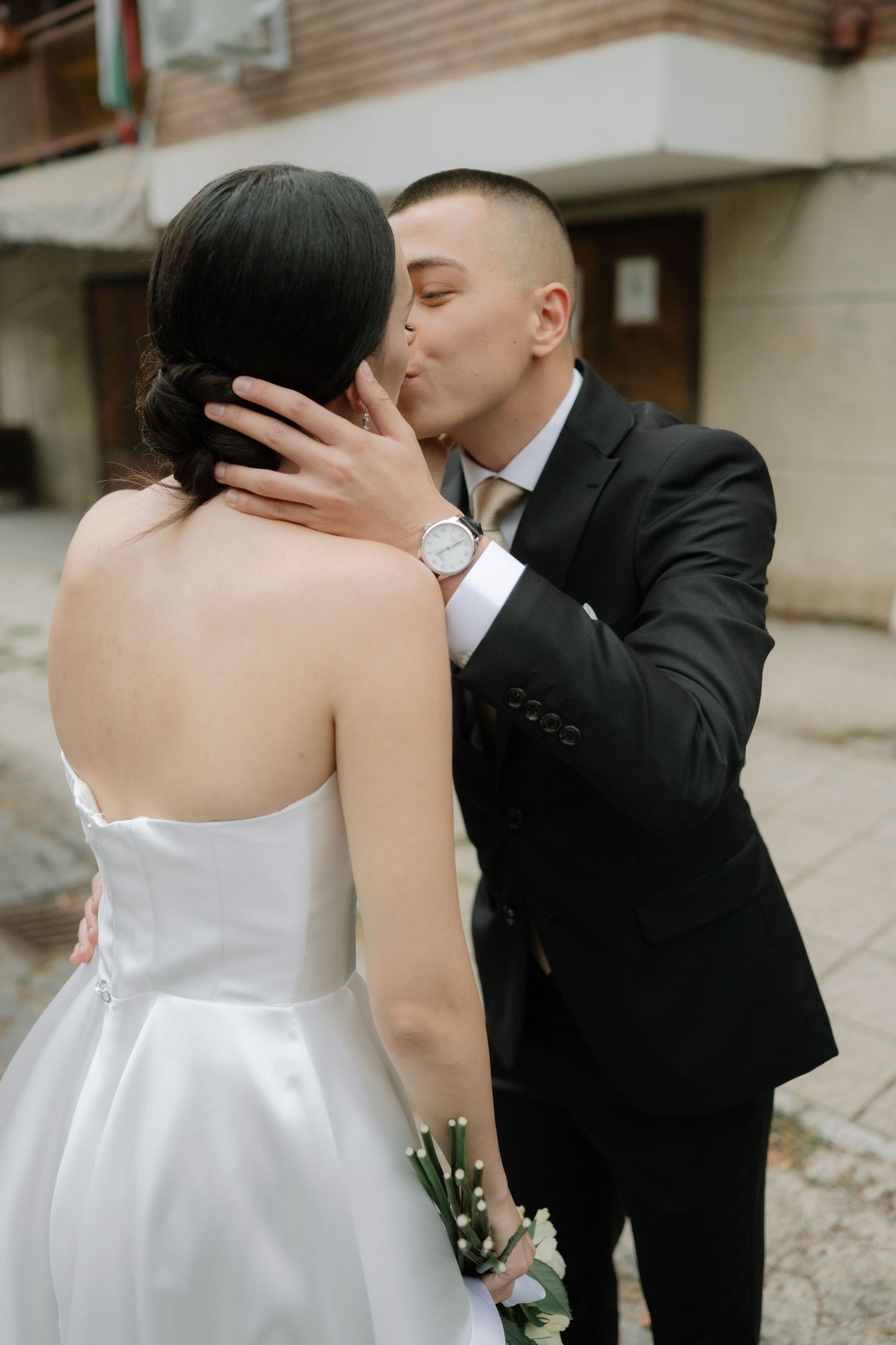 A sequence of romantic wedding photos showing a couple in formal attire sharing intimate moments together.
