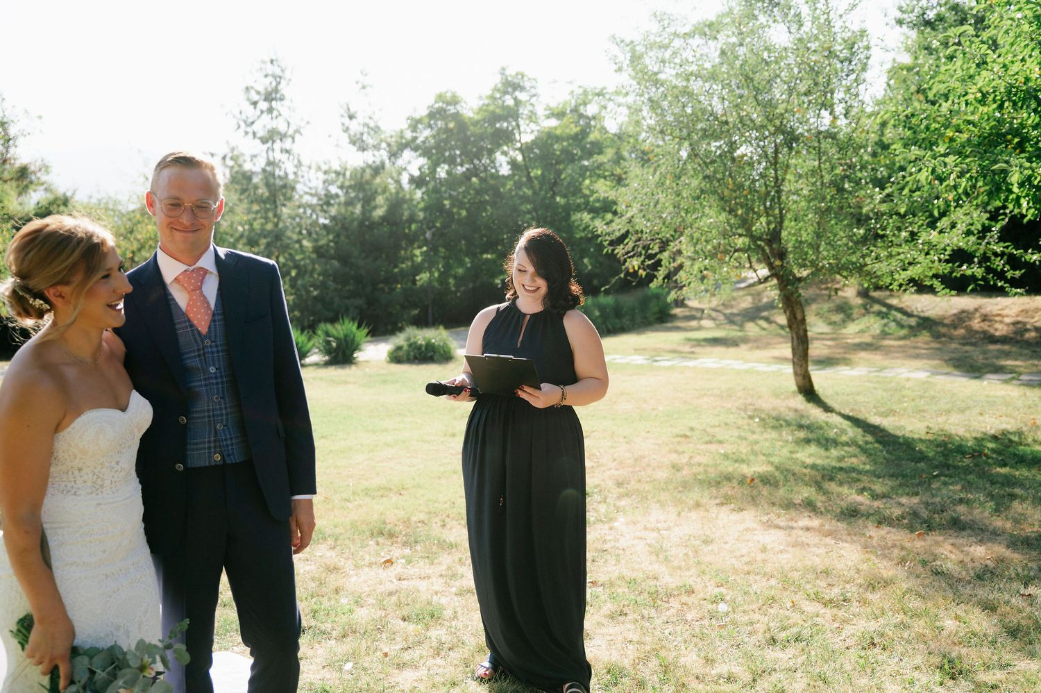 Outdoor wedding ceremony sequence showing interactions between participants in natural lighting.
