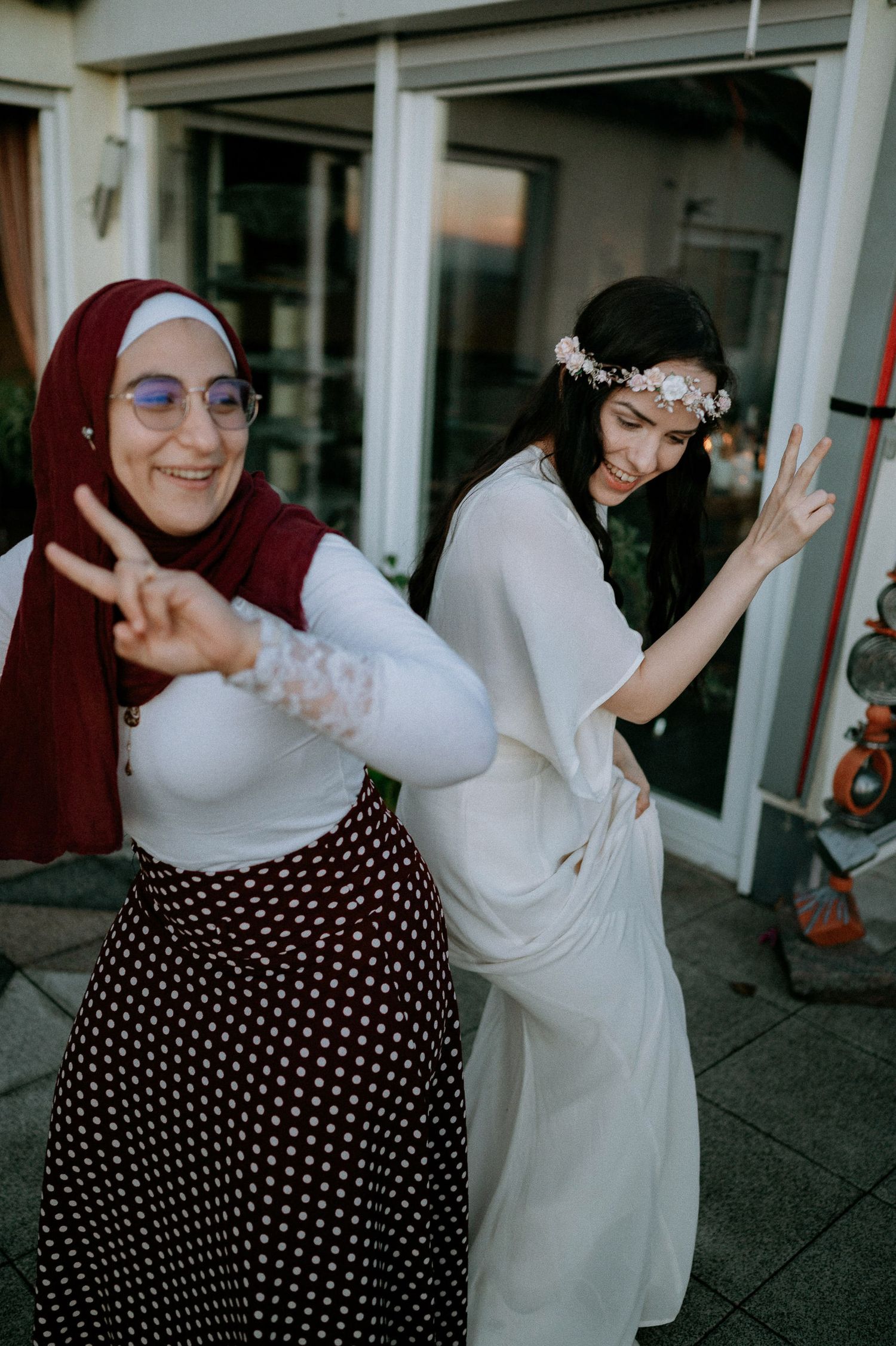 Joyful interactions between friends wearing polka dot skirts and white tops.