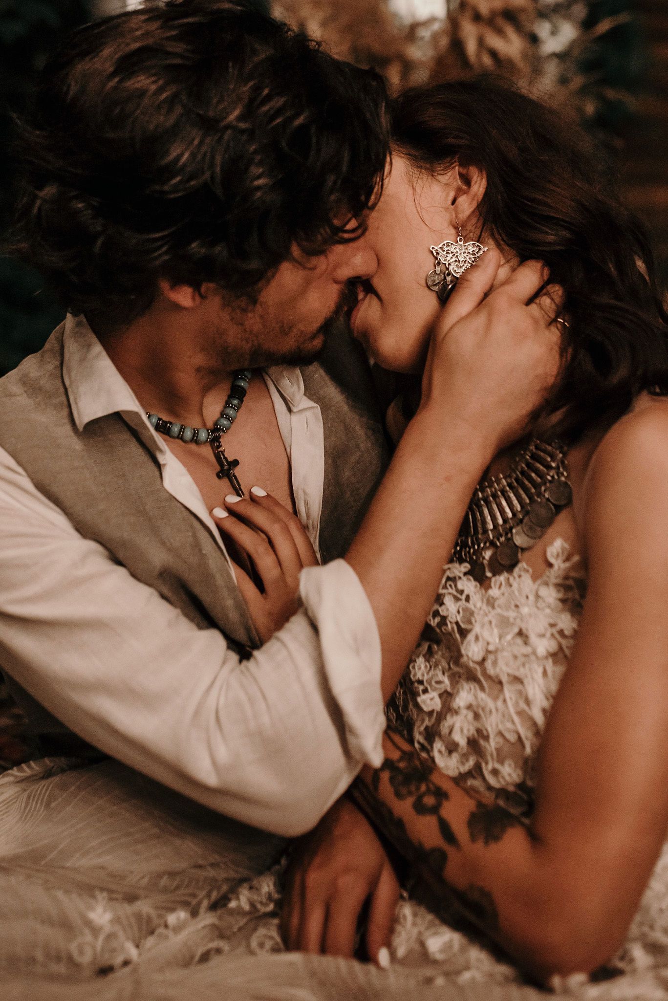 Romantic wedding couple shares intimate close-up moments in a series of sepia-toned photographs.