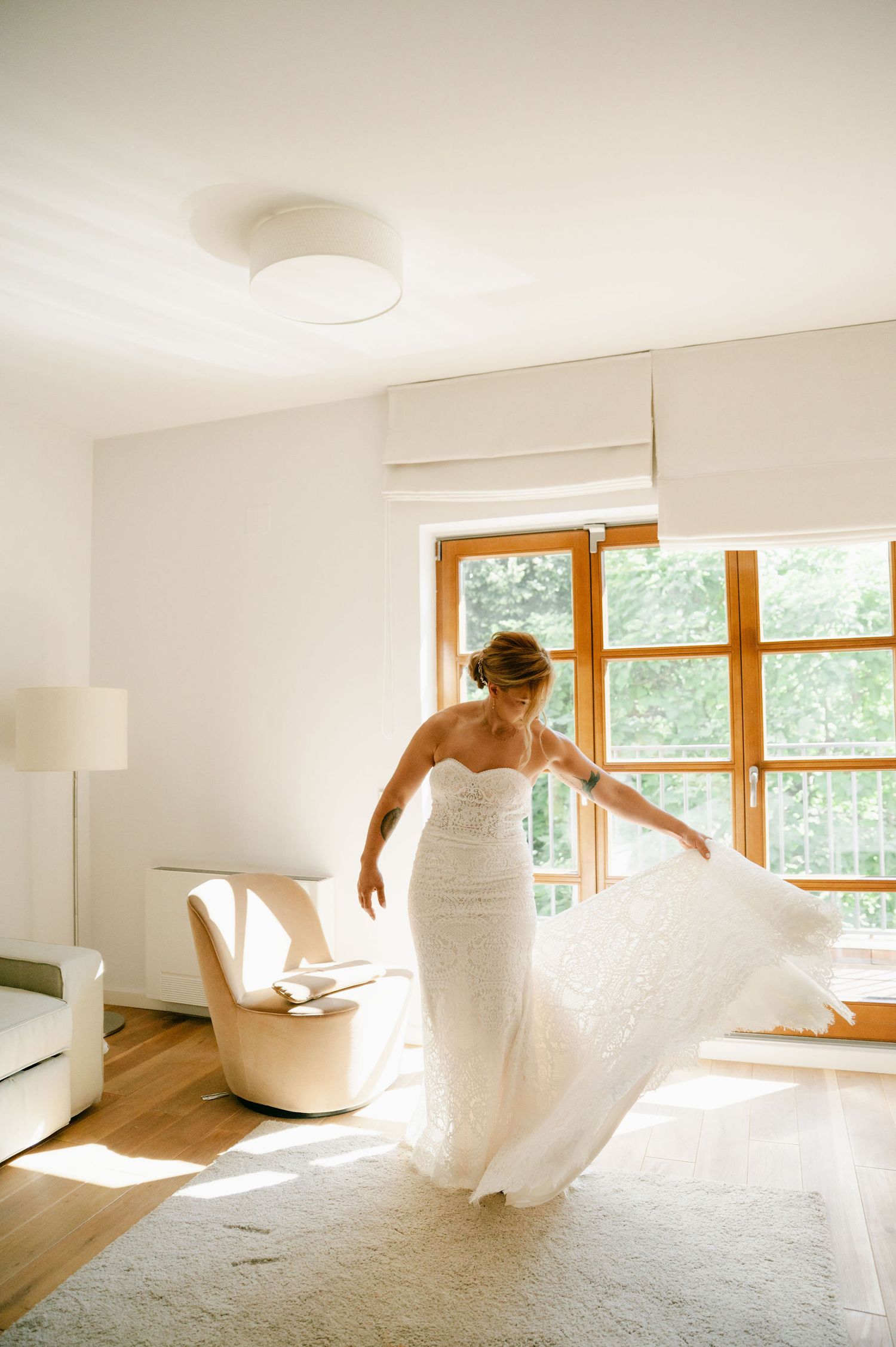 Dynamic shots of a flowing white wedding dress in motion against natural window light.