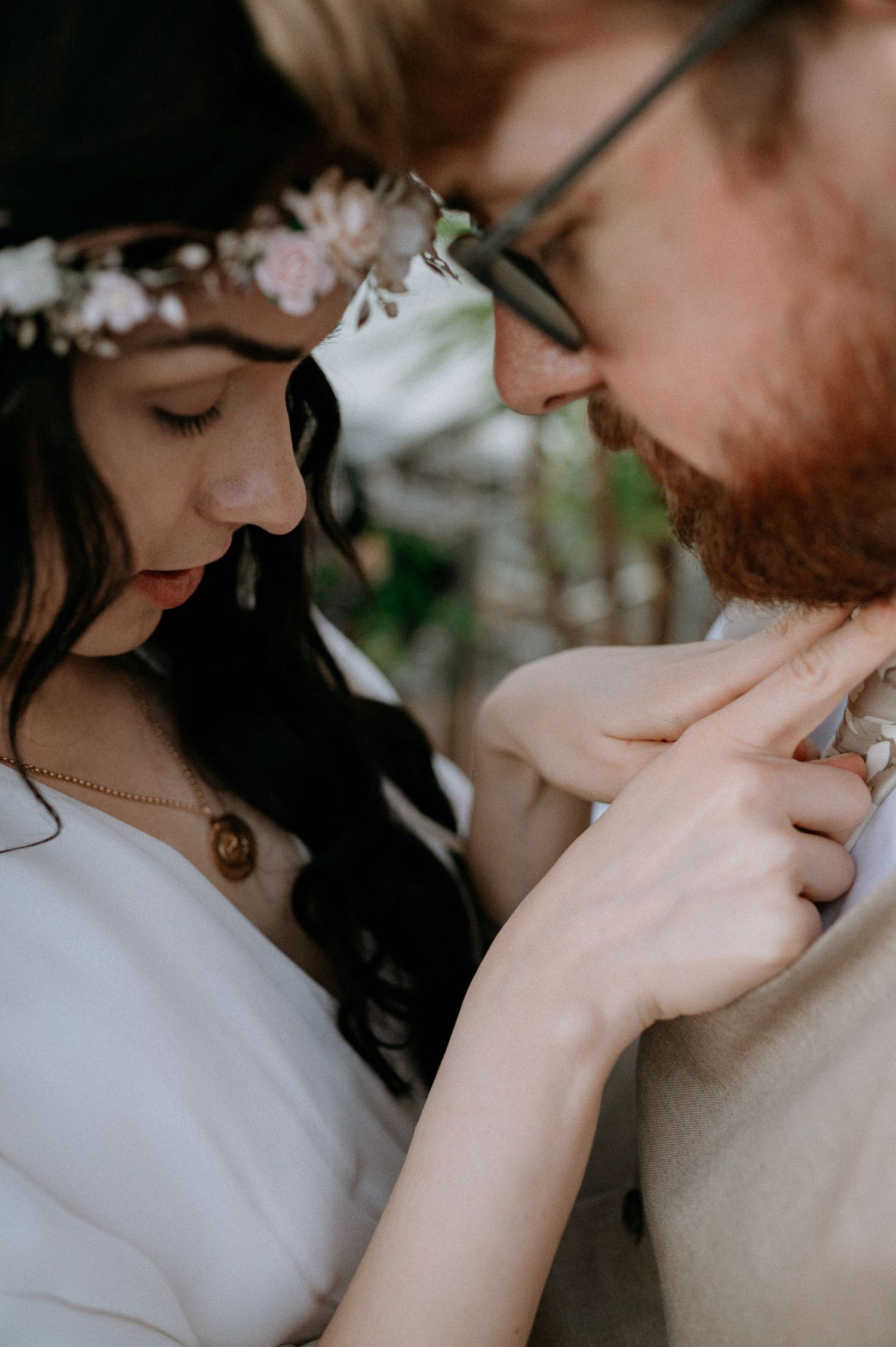 An intimate close-up of newlyweds sharing a quiet moment together.