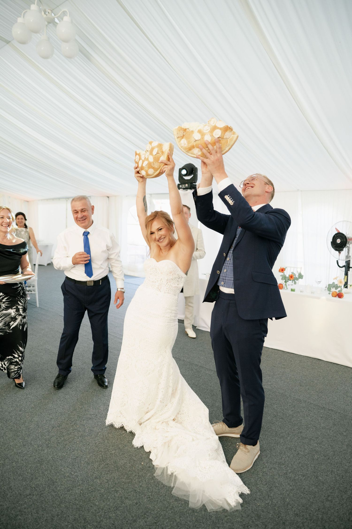 Couples dancing together during a joyous wedding celebration.