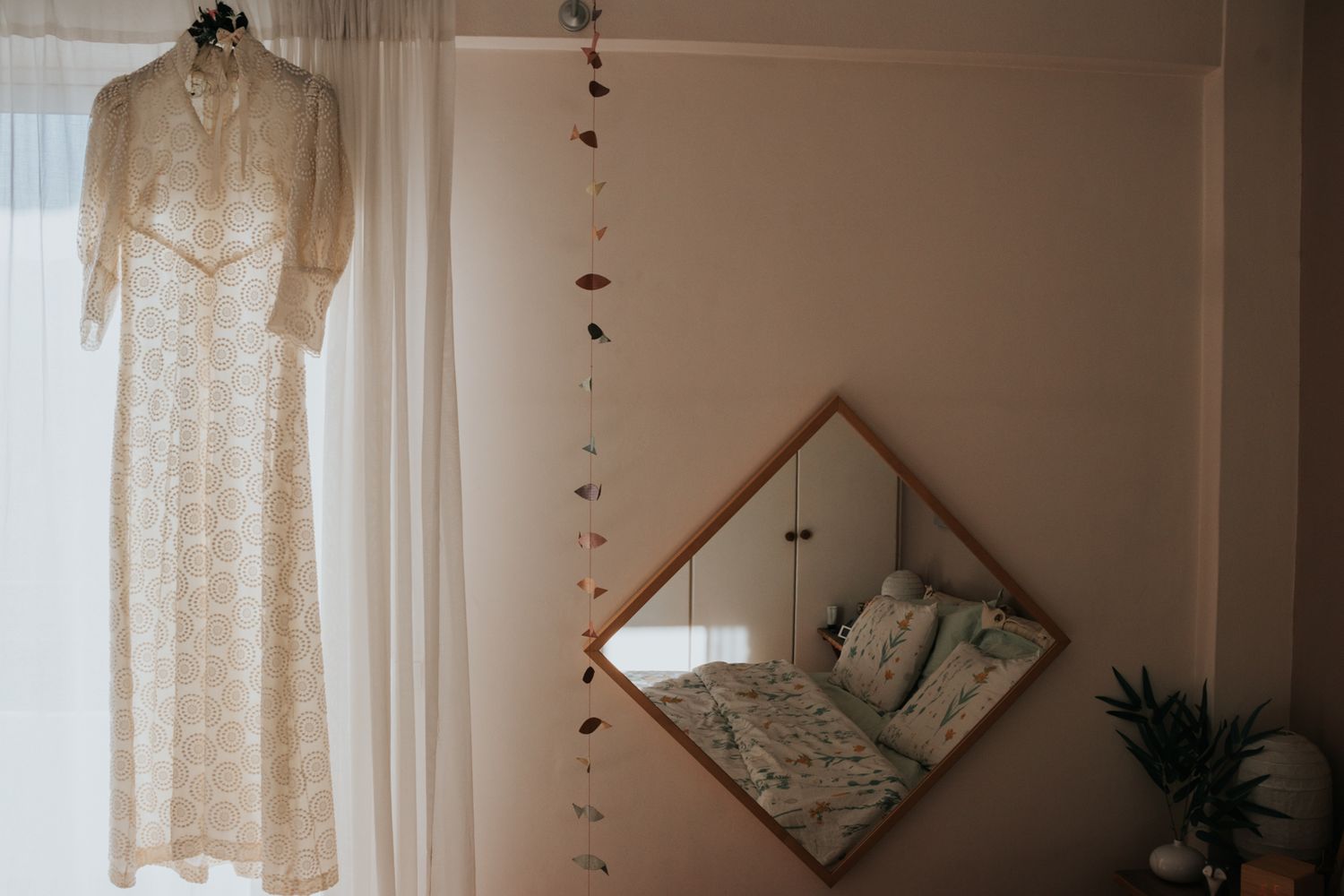 Interior shots of a minimalist room with white curtains and natural light.