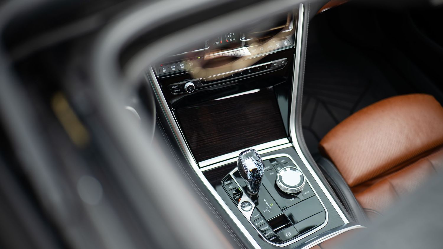 Close-up of BMW's center console showing gear selector and control interface.
