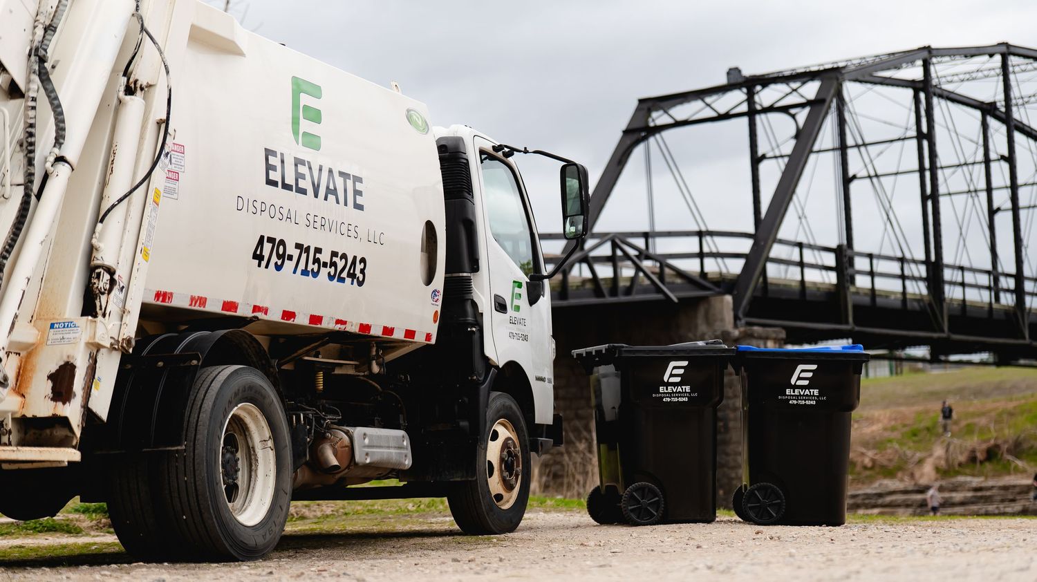 Lineup of commercial service vehicles and trucks parked in a row at a business location.