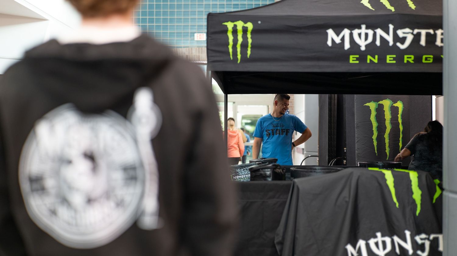 Monster Energy branded tent and display setup at an indoor venue.