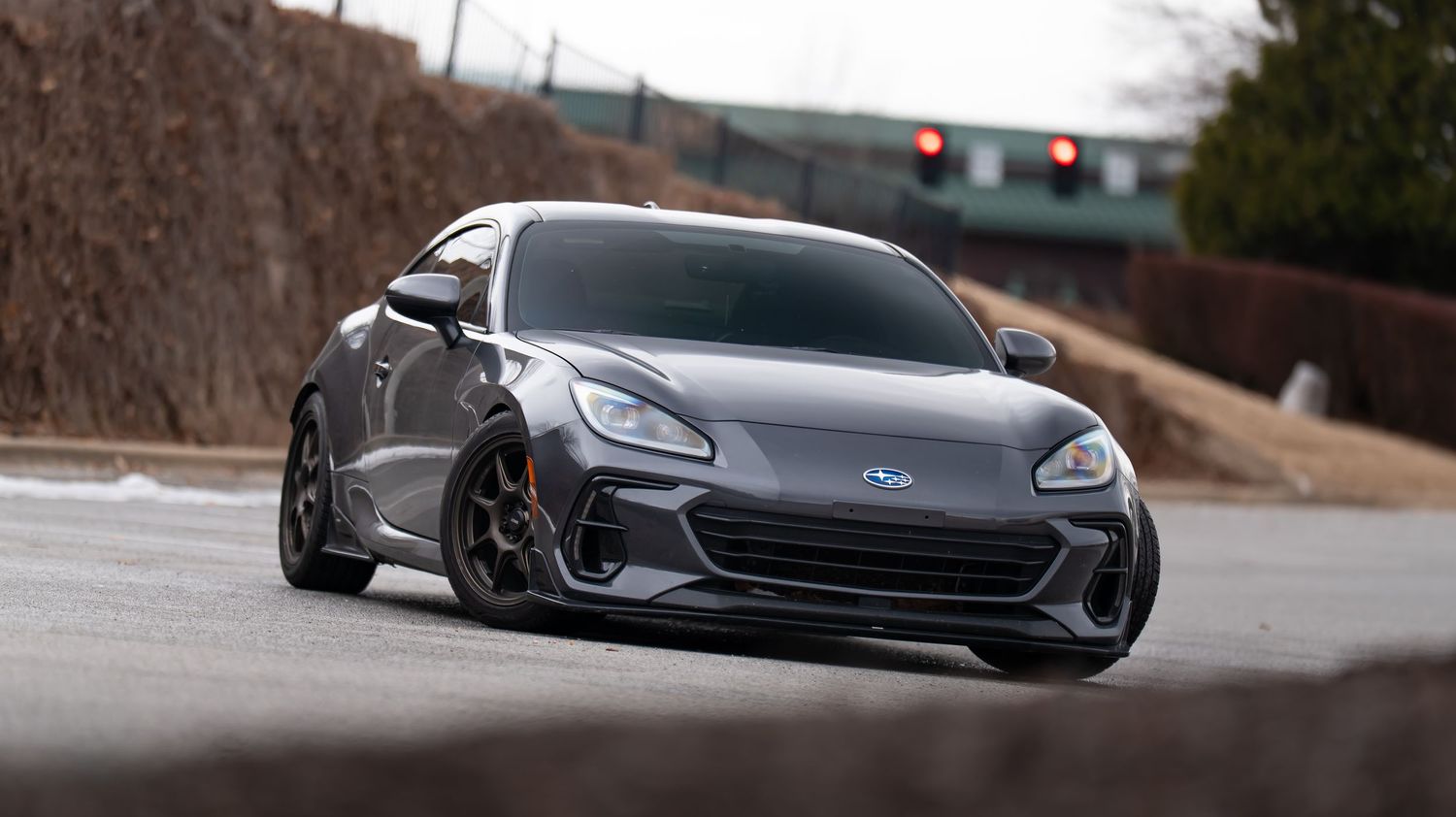 Artistic low angle shots of a modified sports car in an urban setting.
