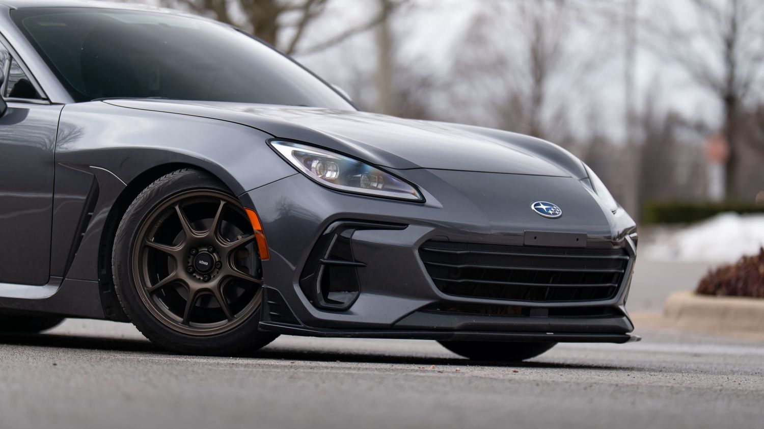 Detail shots of a modified Subaru BRZ highlighting its aerodynamic body modifications.