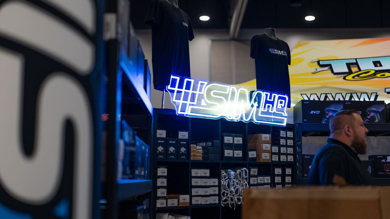 Interior of a dark gym with blue lighting and fitness equipment visible.