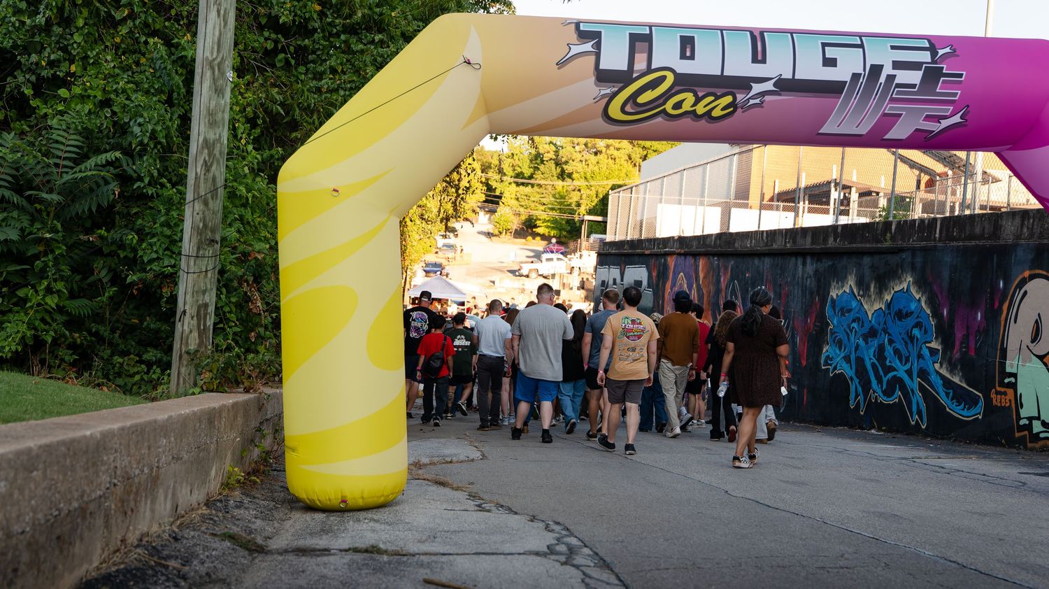 Colorful event banner stretched across an outdoor venue entrance.
