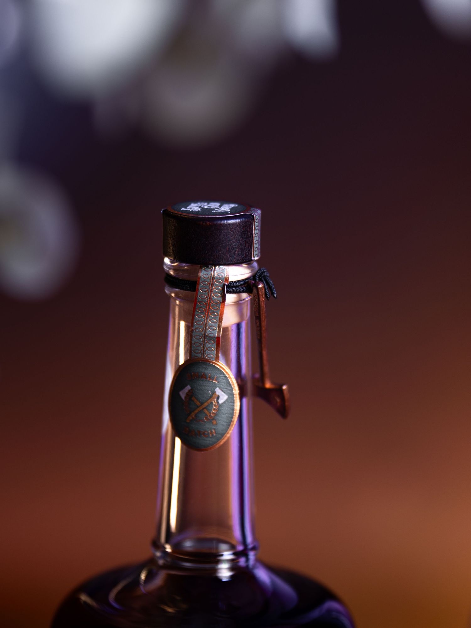 Close-up sequence of a wine bottle cork being removed showing progressive stages of uncorking from multiple angles.