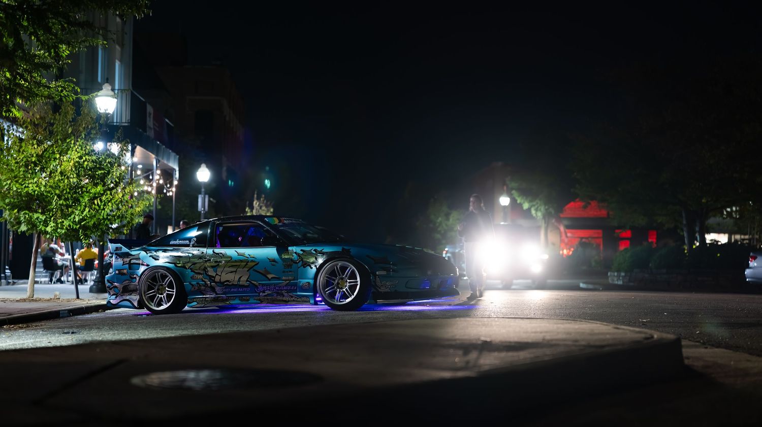 Nighttime exterior shot showing parking lot lights in darkness.