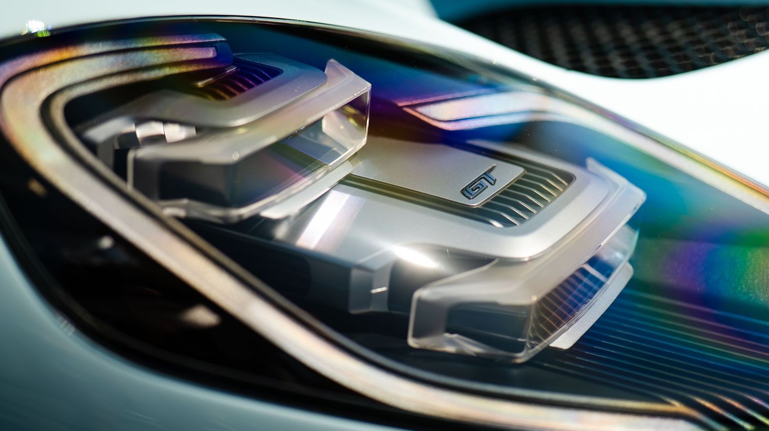 Close-up of a modern car dashboard display showing colorful digital interface elements.