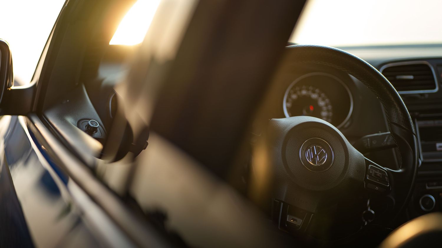 Close-up interior dashboard shots of modified Volkswagen vehicles showing custom gauges and displays.