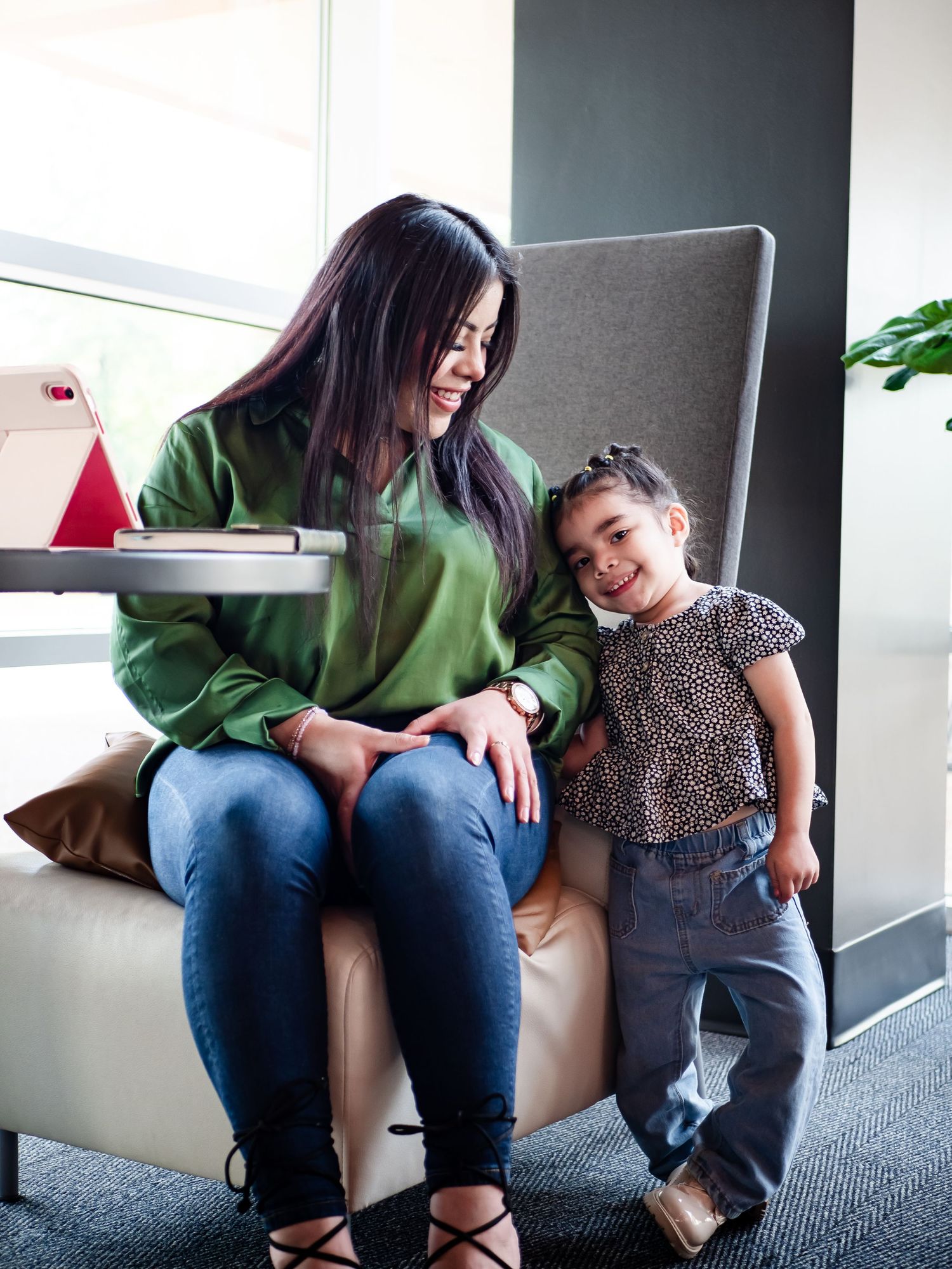 Series of candid moments showing person in green sweater and jeans sitting on indoor ledge.