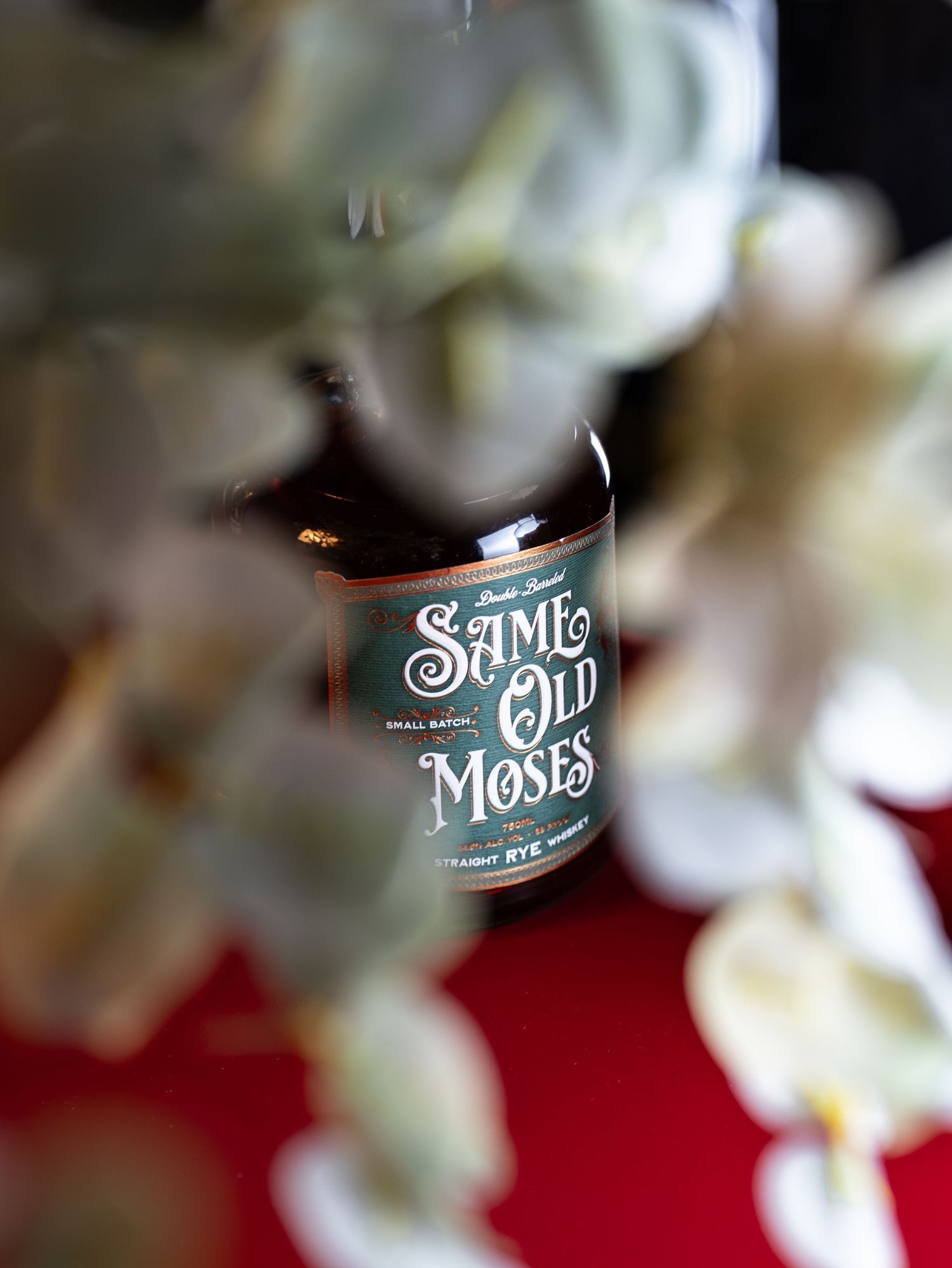 Multiple blurred close-up shots of a glass jar or container with white text against a dark background.