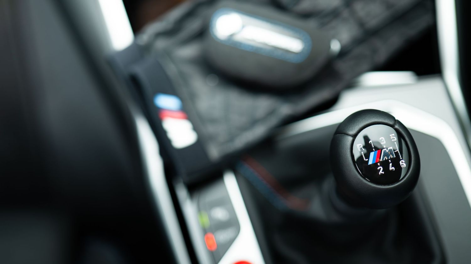 Close-up interior details of a modern BMW vehicle dashboard.