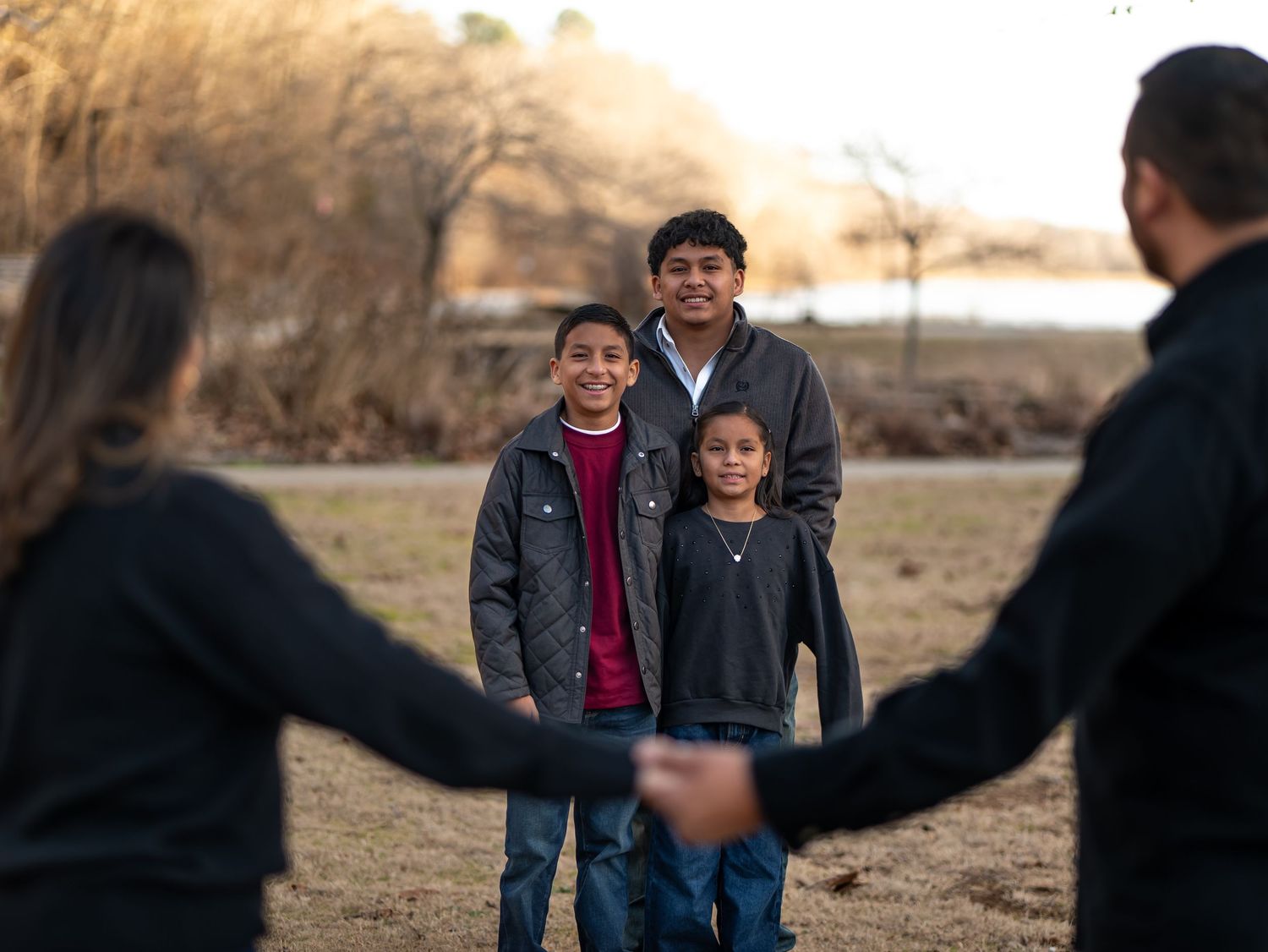 A sequence of photos showing a person receiving a gift in an outdoor setting during winter.