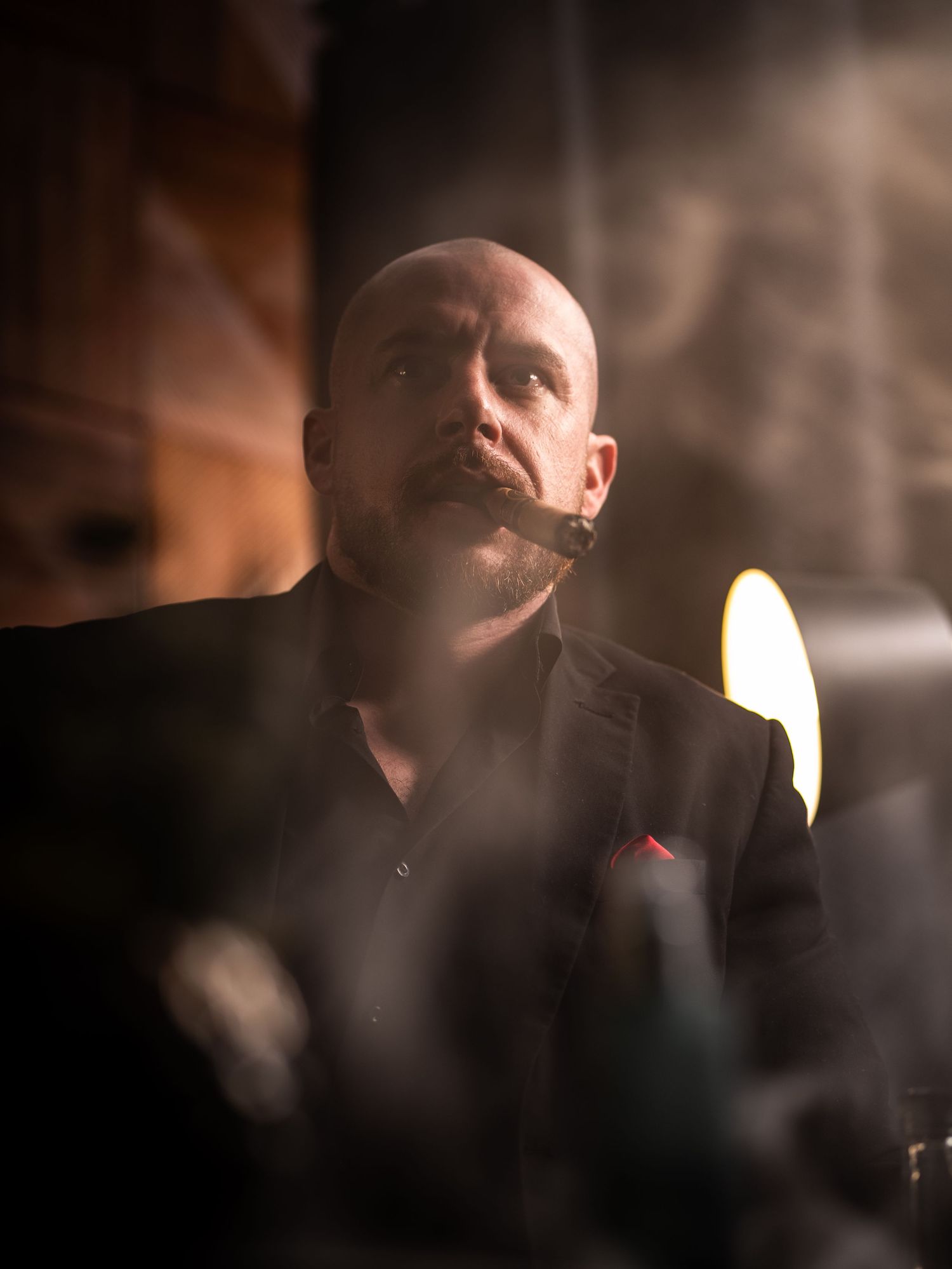 A moody sequence of portraits showing a person smoking in atmospheric lighting with swirling smoke effects.
