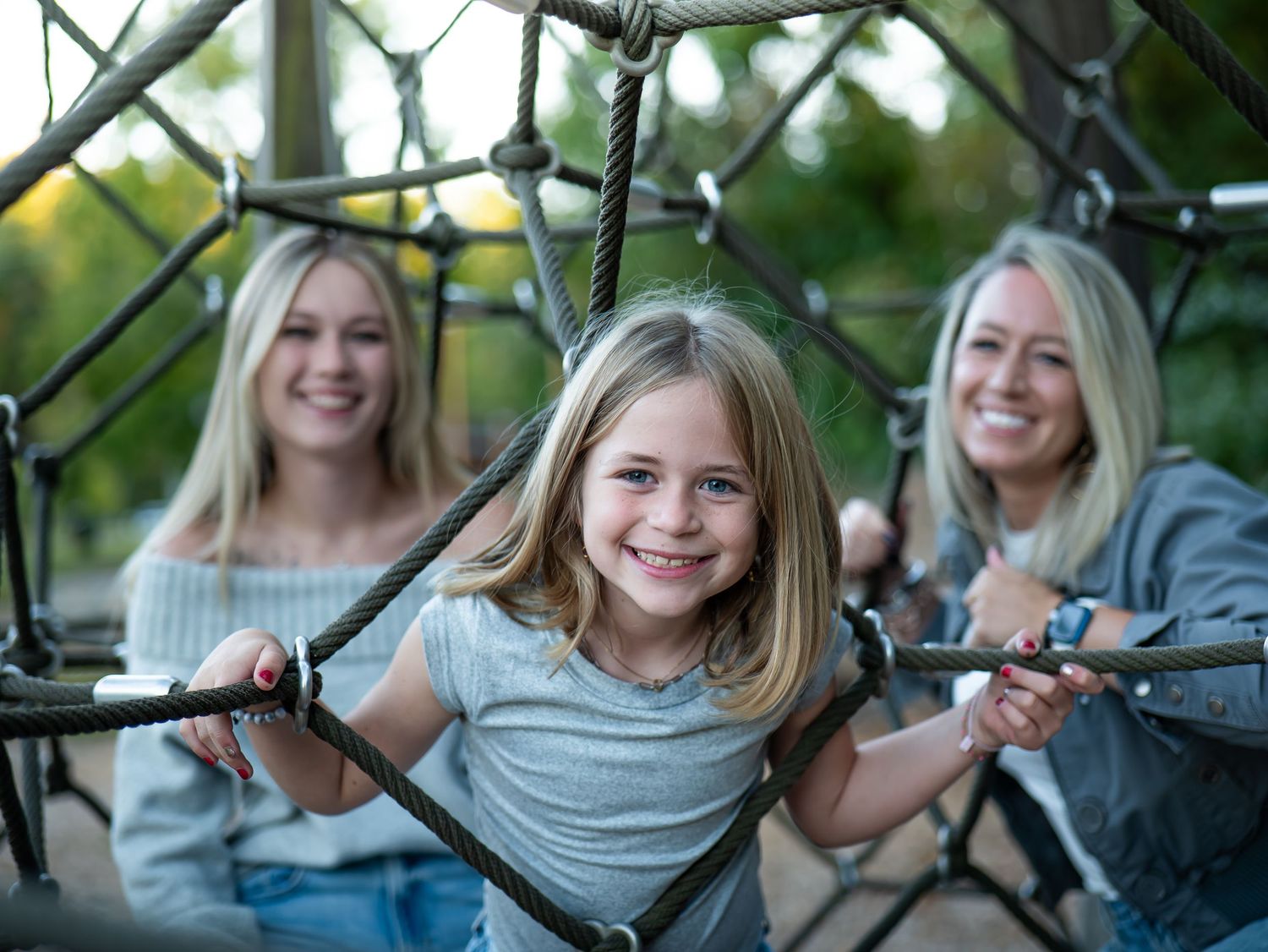 A series of six candid outdoor photos showing joyful moments and laughter in a natural setting.