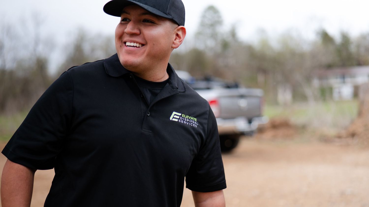 Team members in uniform working together at an outdoor service location.