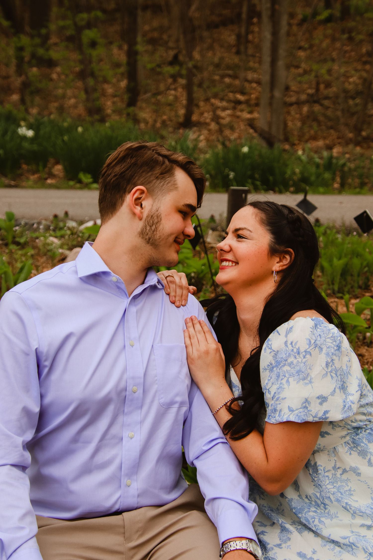 Smiling at each other.