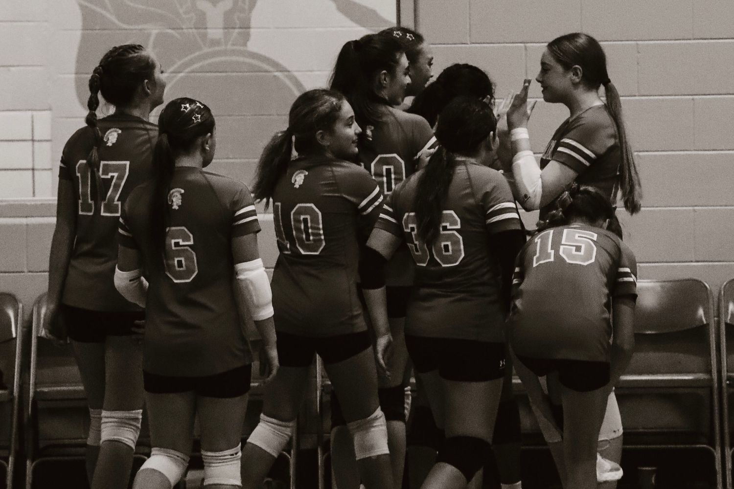 Victory volleyball win hug.