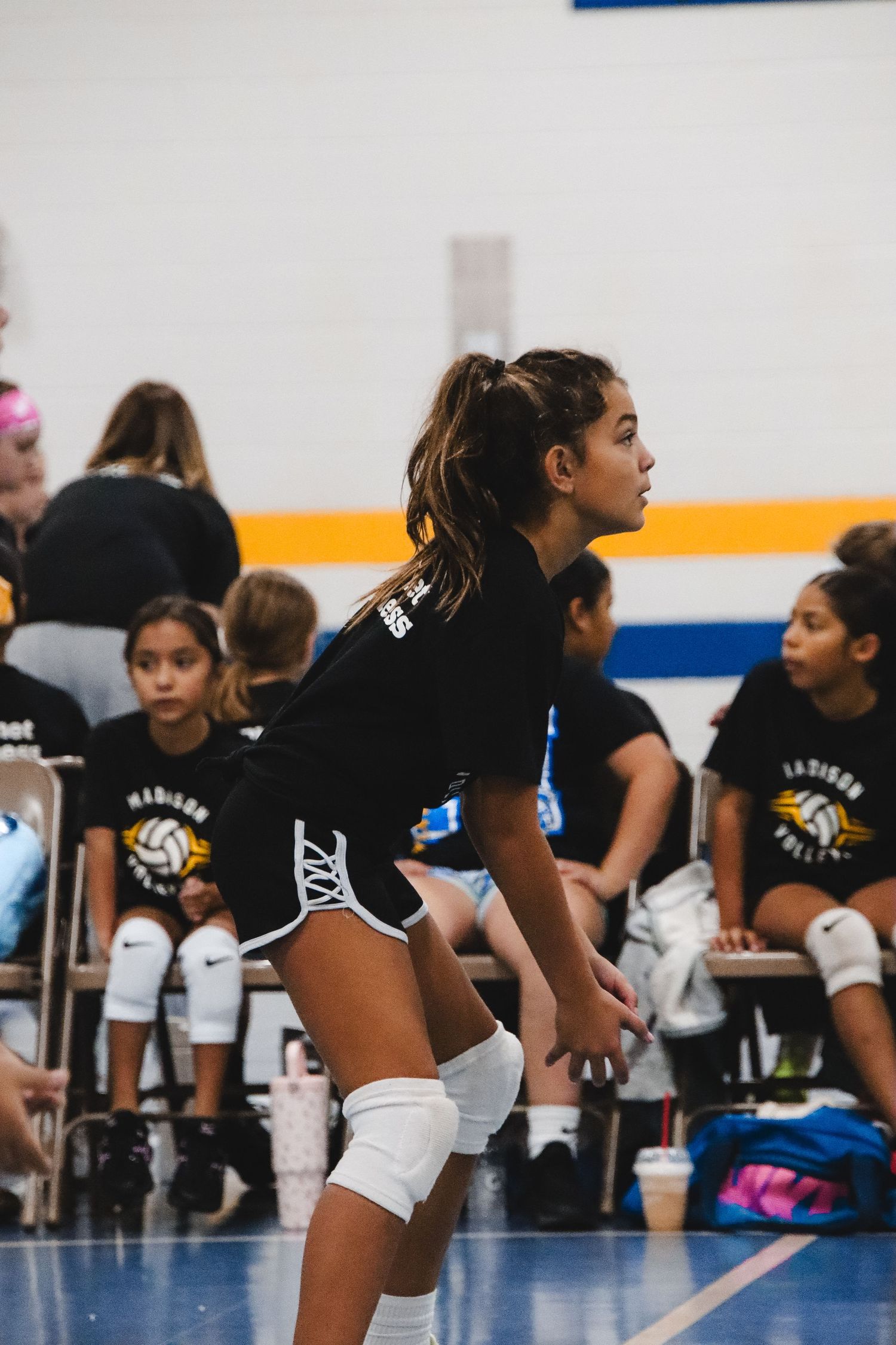 Waiting for the volleyball to get to her.