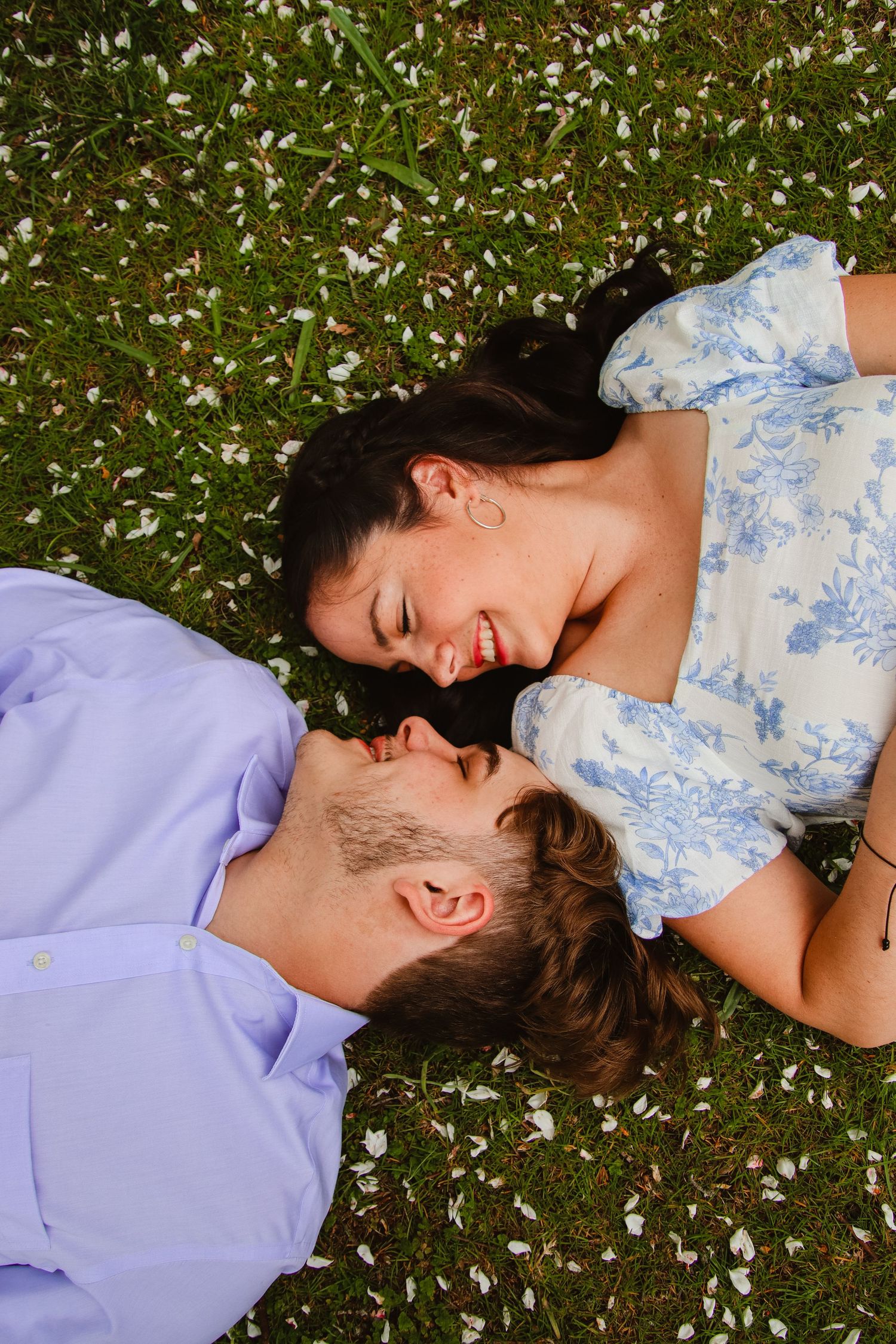 Laying in the flowers and smiling at each other.