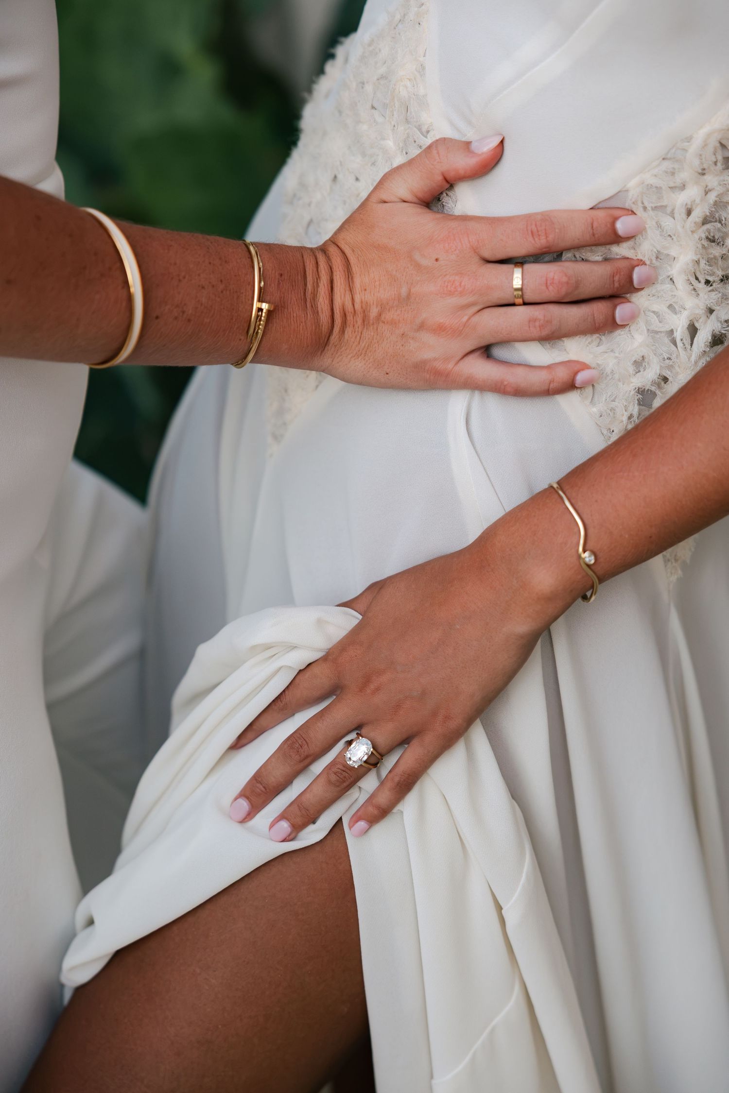 Detail shot of the engagement ring on brides hand at Acre.