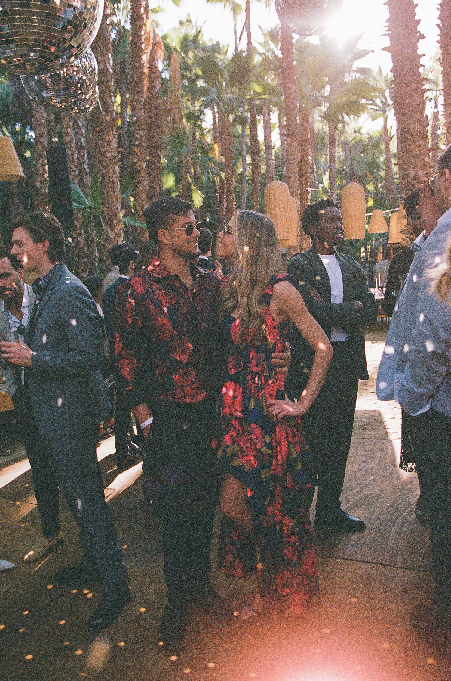 Wedding guests showing off outfits during cocktail hour in Todos Santos.