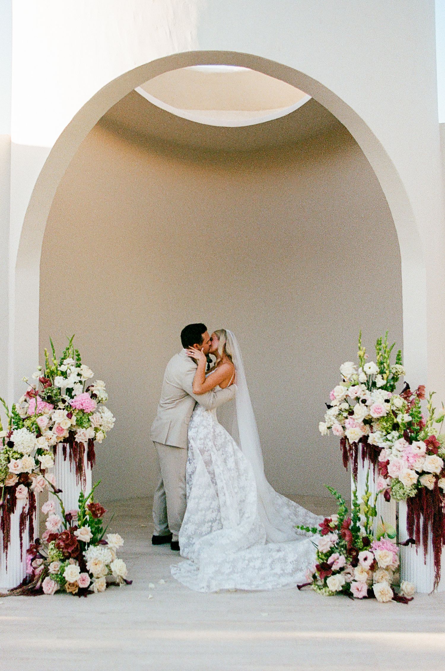 Newlyweds sealing the ceremony with kiss at Baja Luna.