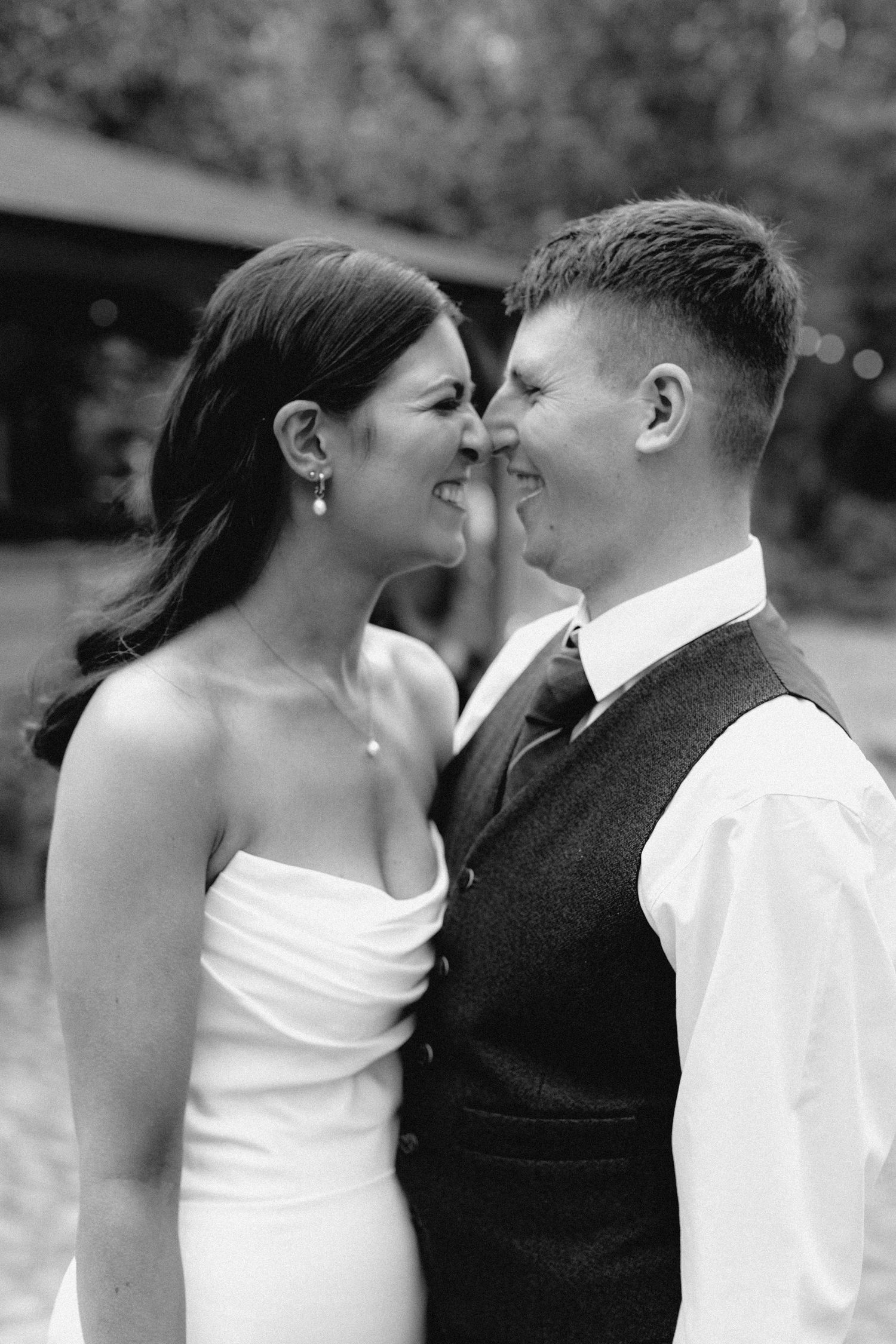 A romantic black and white photo sequence shows a couple sharing tender kisses in their wedding attire.