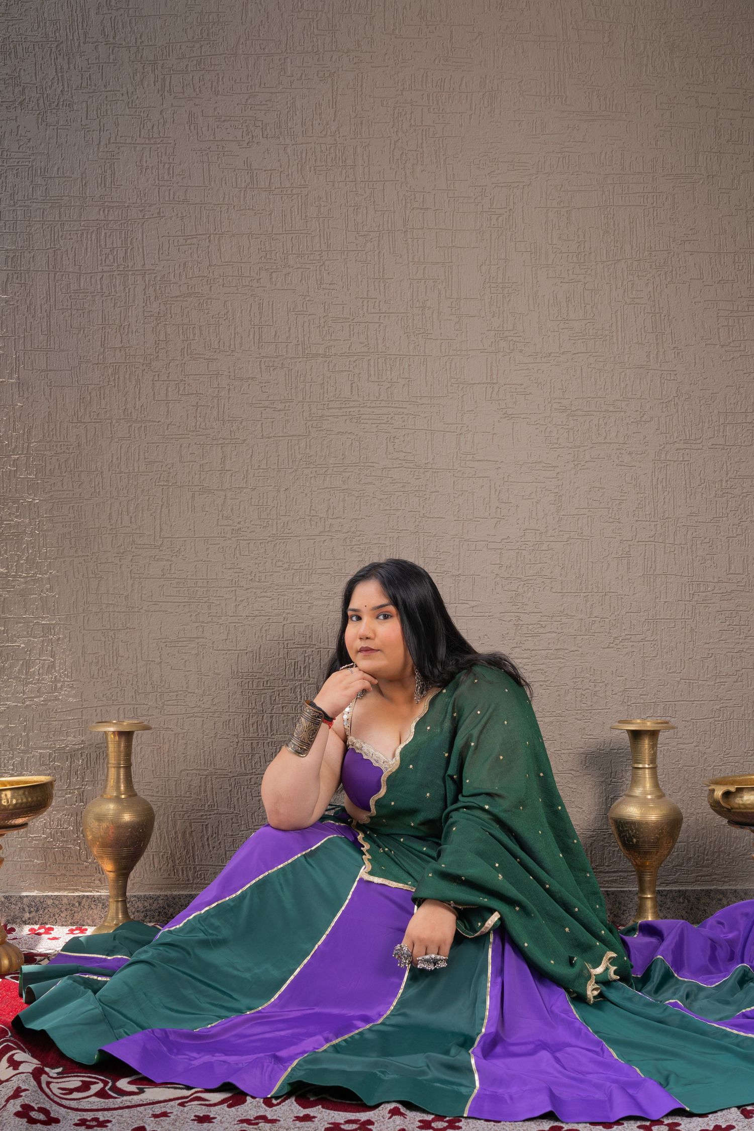 Model posing in an elegant ethnic Chaniya Choli during a luxury fashion photography campaign.