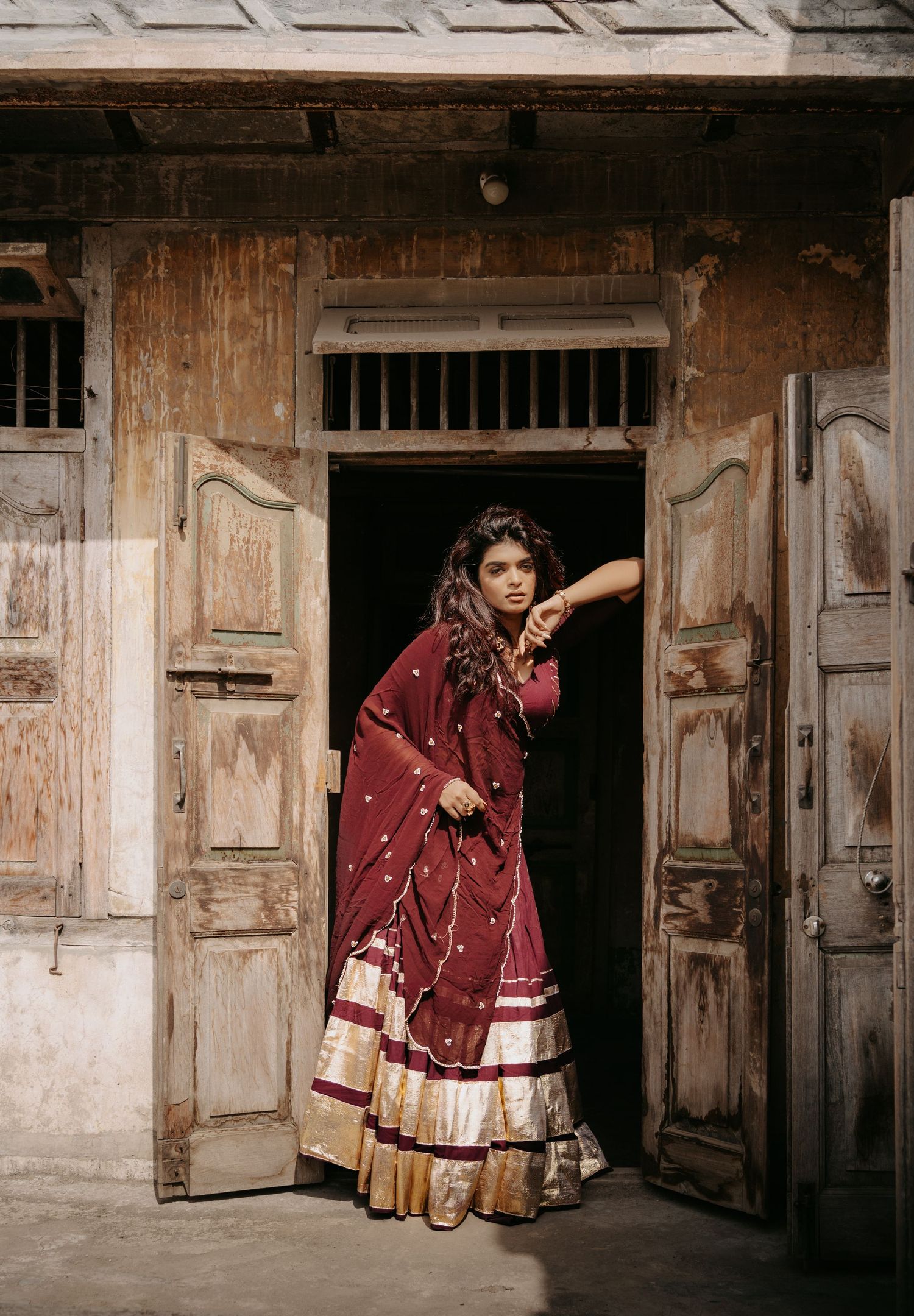 Editorial fashion photography highlighting traditional Indian craftsmanship through a luxury Chaniya Choli design.