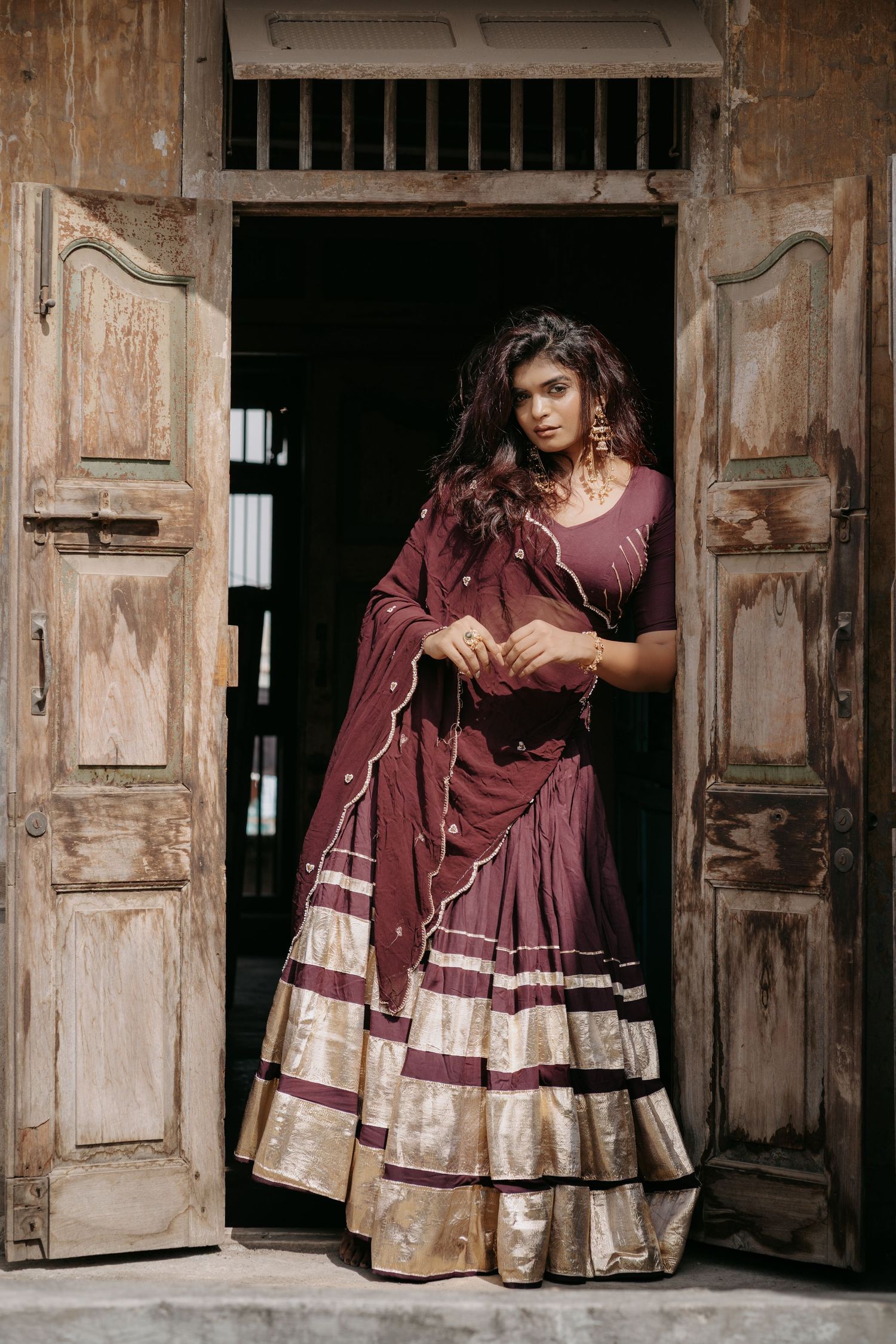 Creative fashion portrait of a model wearing a beautifully embroidered festive Chaniya Choli.