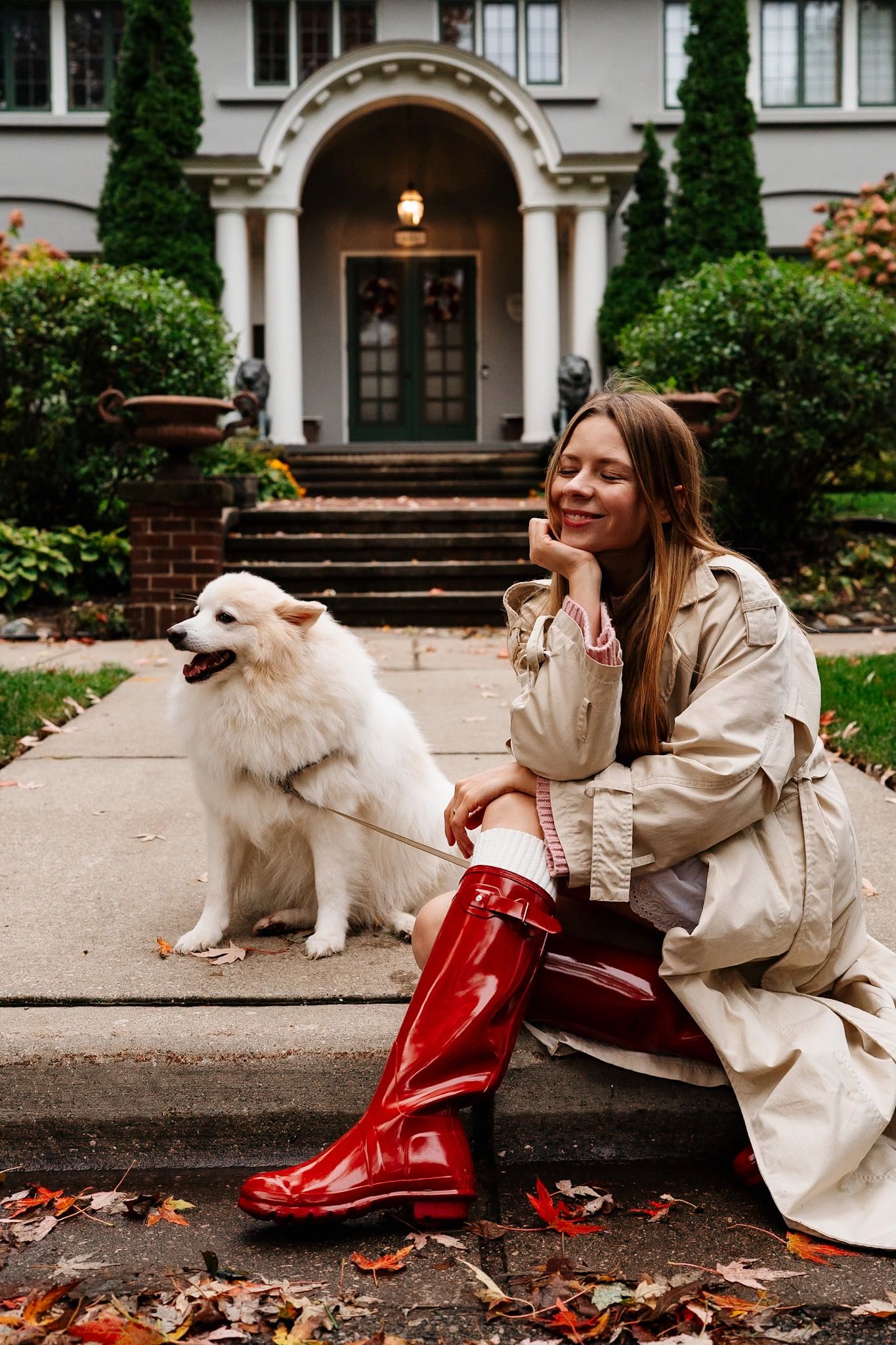 Logan the dog sitting beside its owner during a portrait session in Heritage Hill.