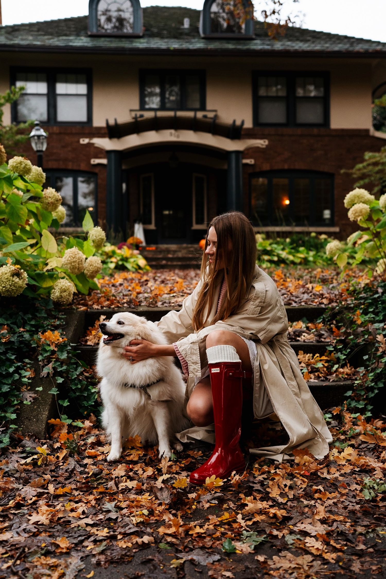 Woman and her dog enjoying an autumn afternoon in Heritage Hill.