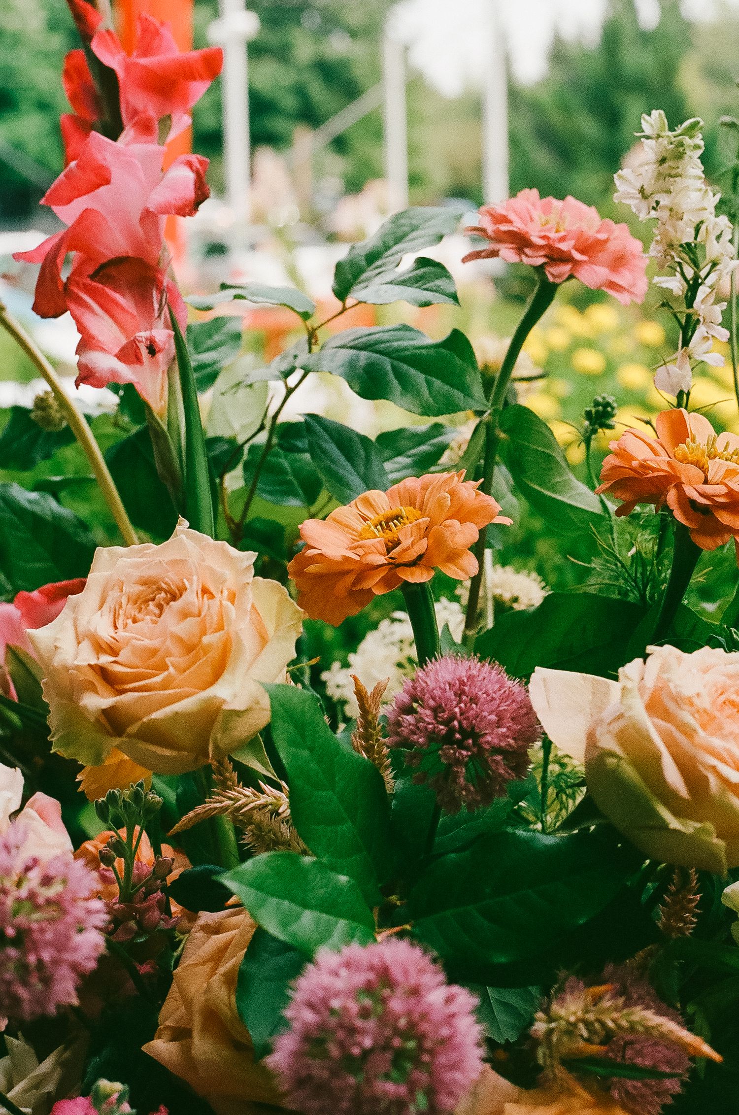 Colorful floral arrangements decorating a wedding reception at the Saugatuck Center for the Arts.