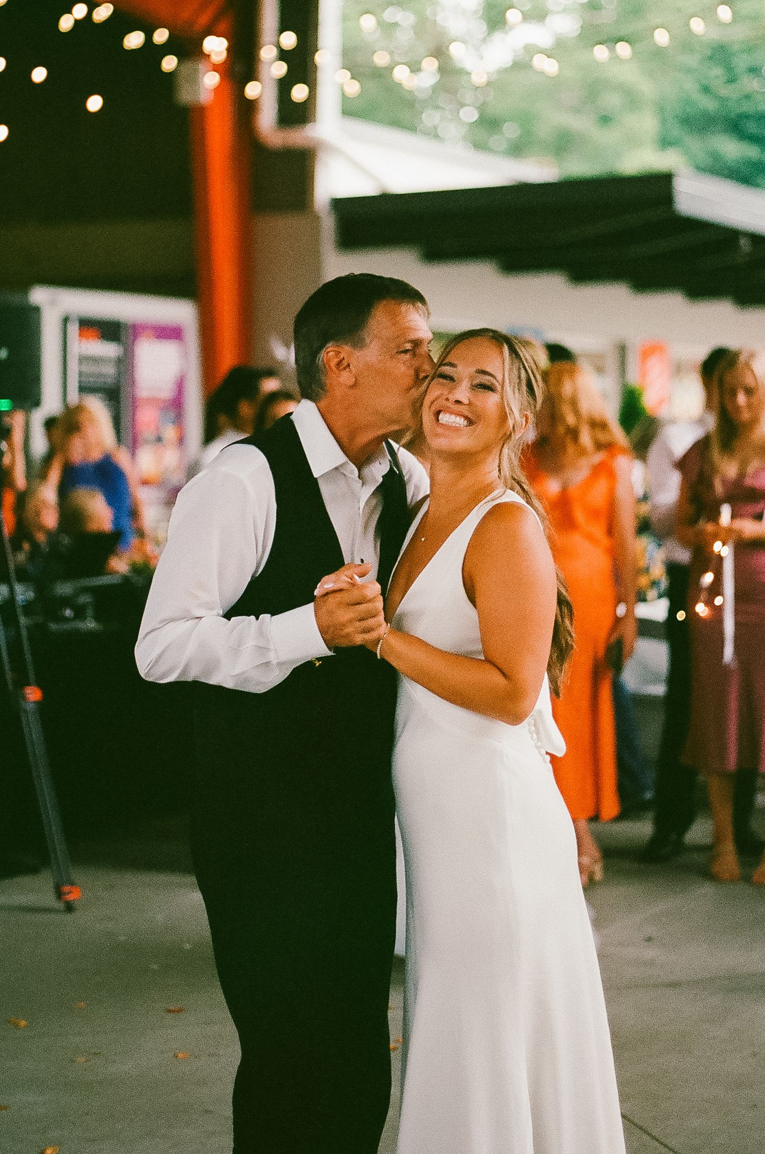 Daughter and Father first dance share a small kiss at the Saugatuck Center for the Arts.