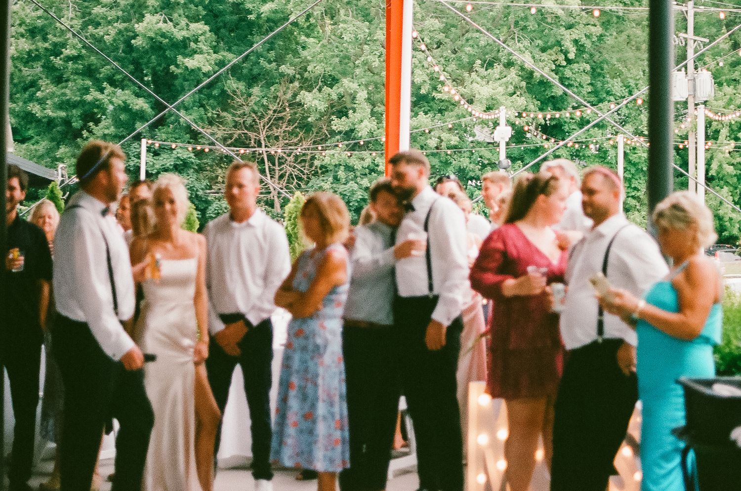 Bride and groom friends celebrating together during their wedding reception at the Saugatuck Center for the Arts.