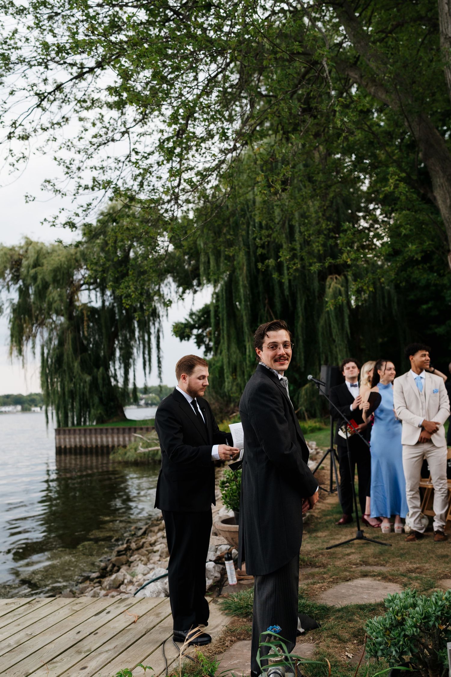 Bride and groom embracing outside Marigold Lodge on their wedding day.