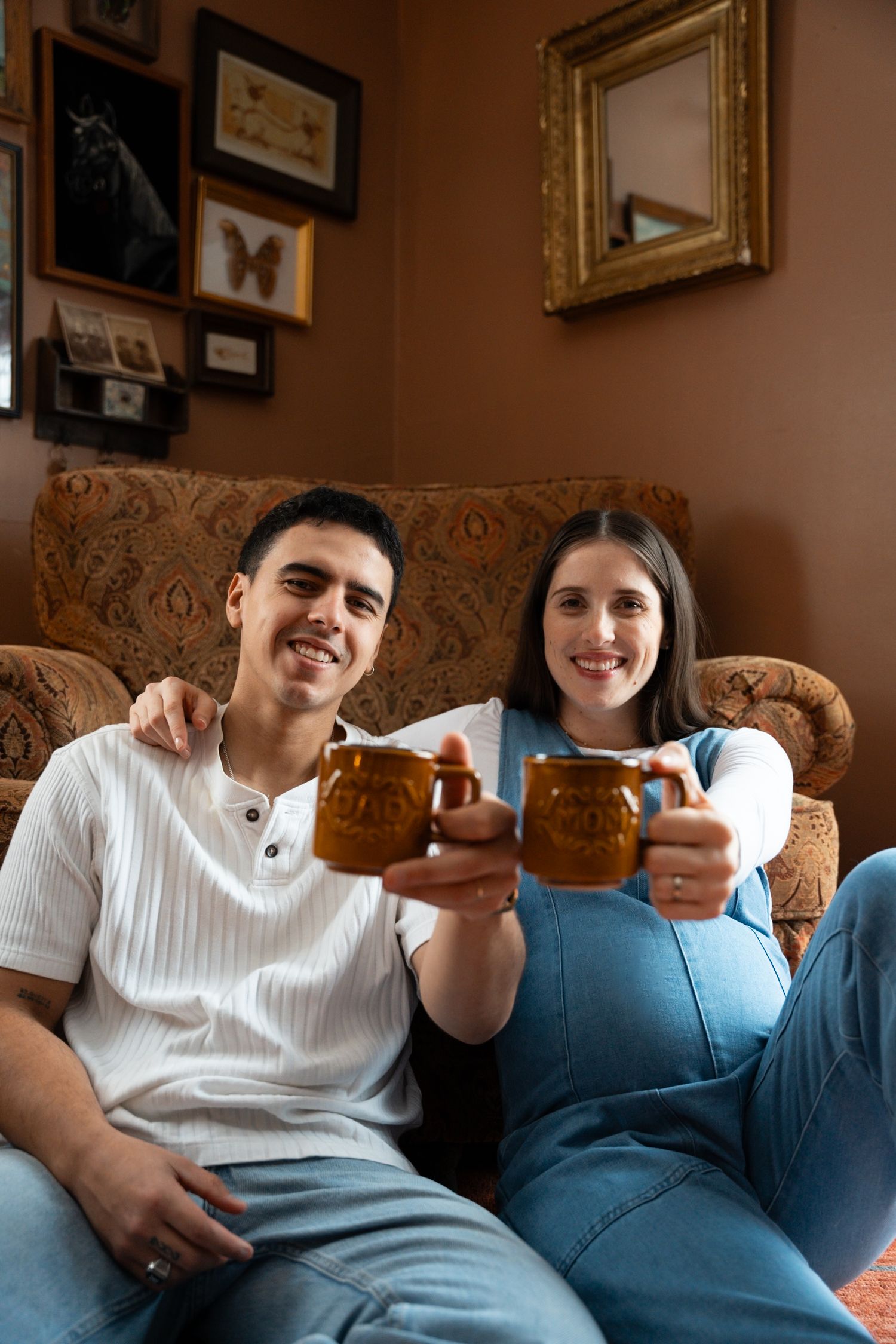Expectant parents enjoying a quiet morning together during an in-home maternity session.