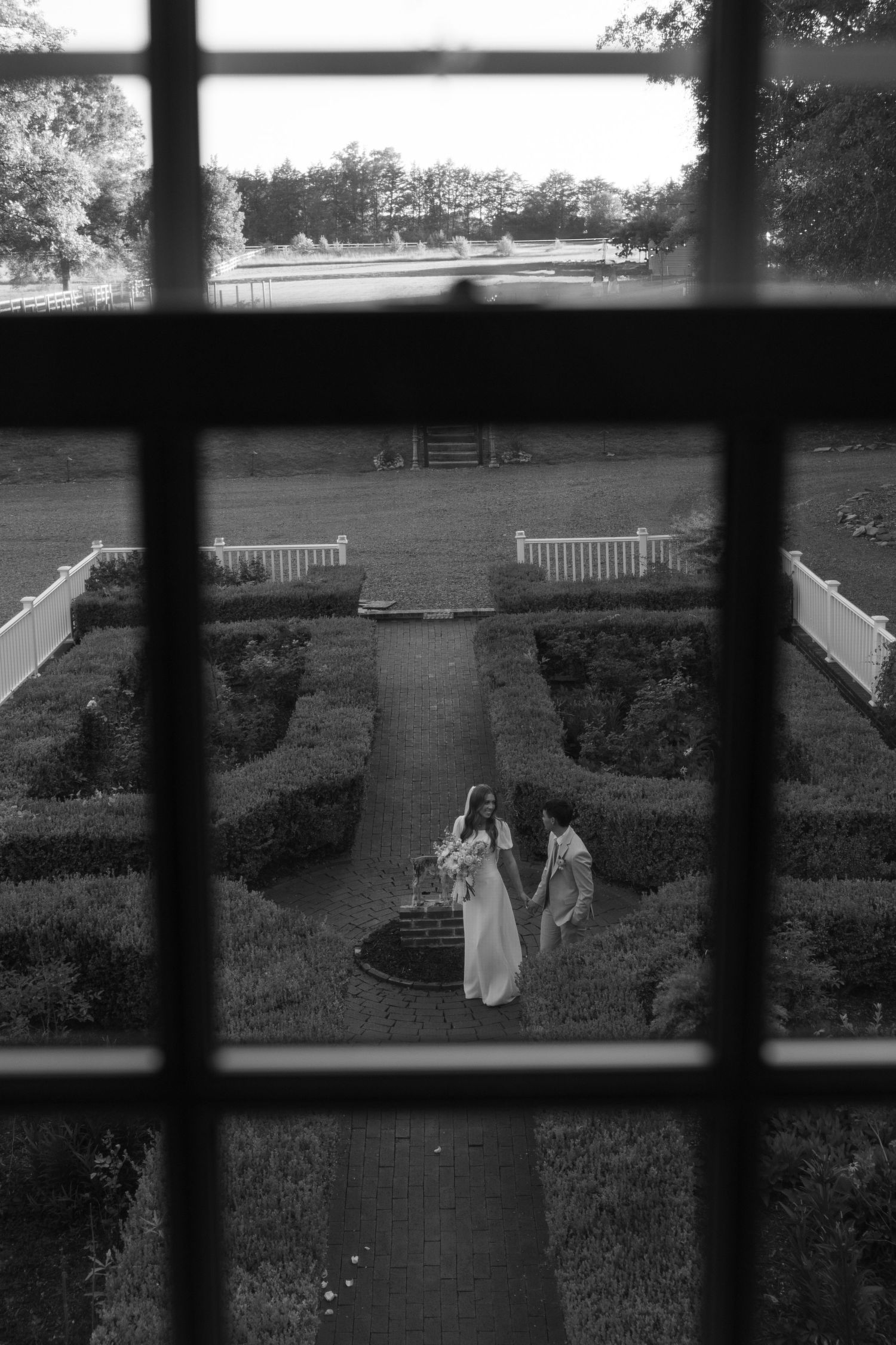 Bride and groom portrait taken through a window at The Historic Robertson Homestead, photo by Rock Hill Wedding Photographer, Natalie Wilson