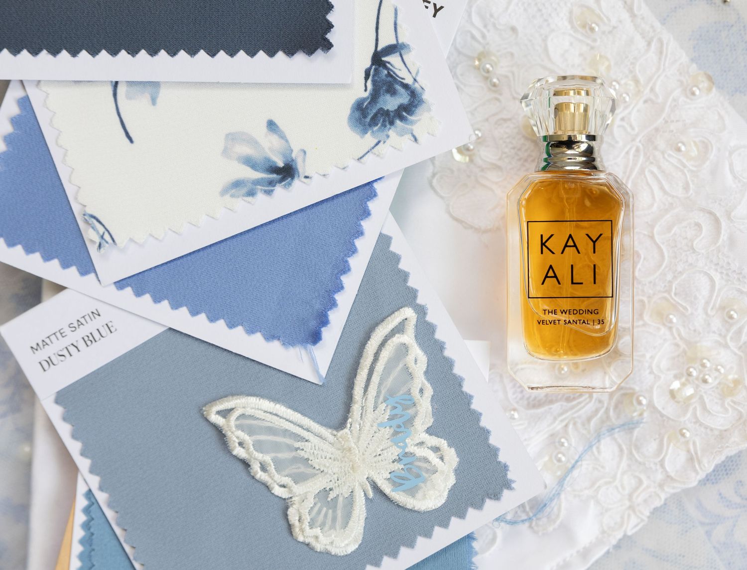 Wedding details including perfume and color swatches. Photo at The Historic Robertson Homestead by Rock Hill Photographer, Natalie Wilson